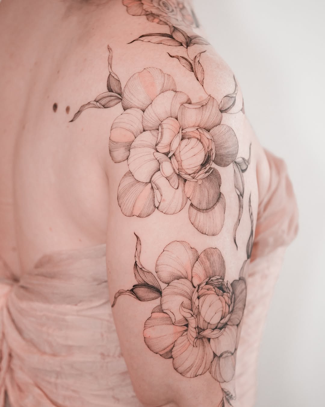 Peony flowers realism tattoo on the shoulder by Zalina Loriia