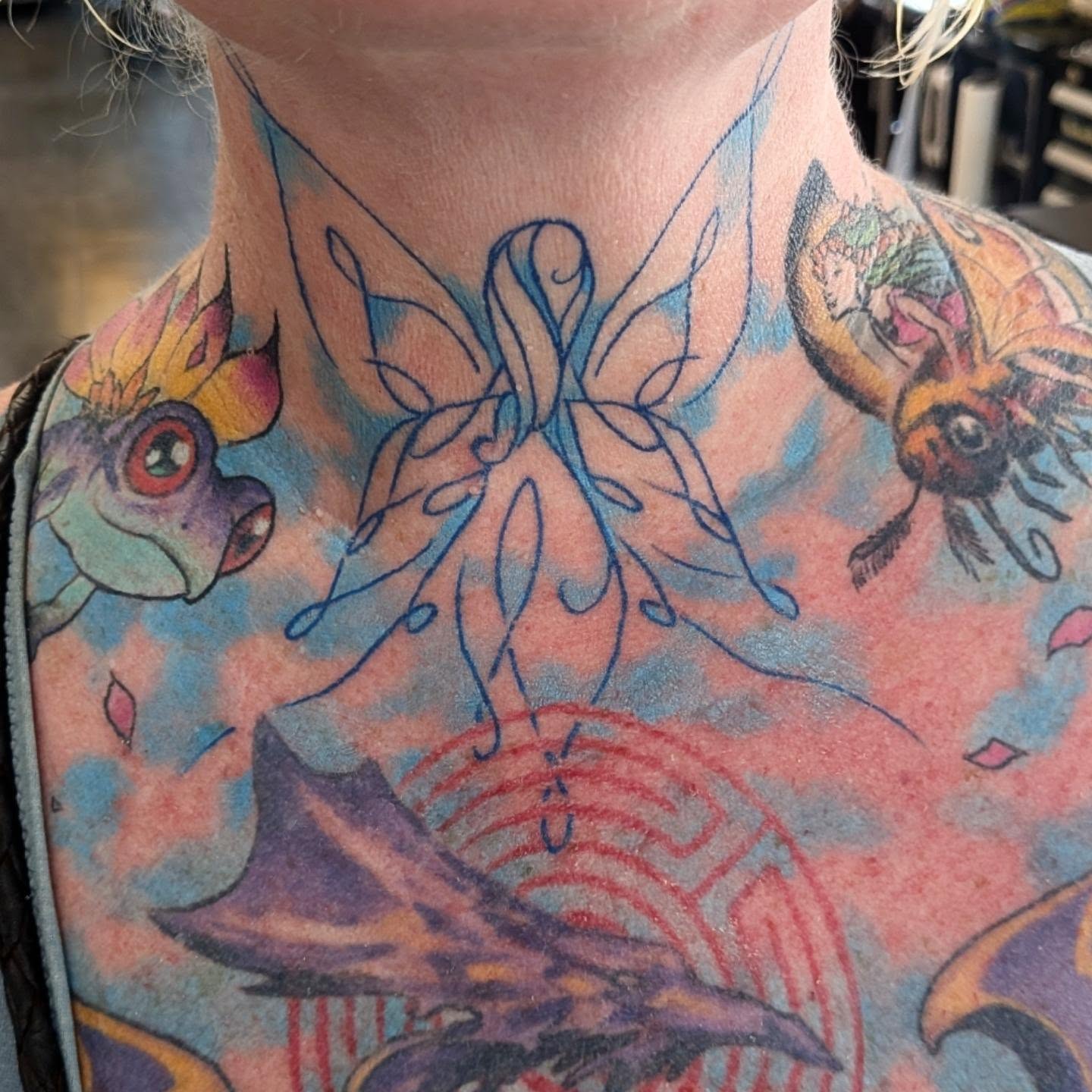 Fairy and dragon new school tattoo on the neck by Nic Skrade, Minneapolis, Minnesota