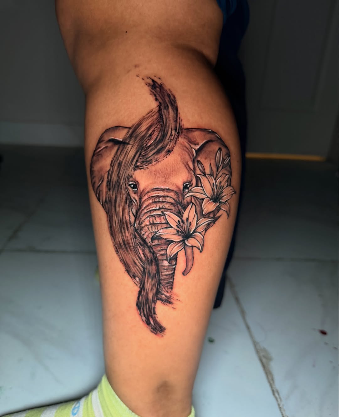 Elephant and flowers realism tattoo on the thigh by Porshamonie' THE Tattoo ARTIST
