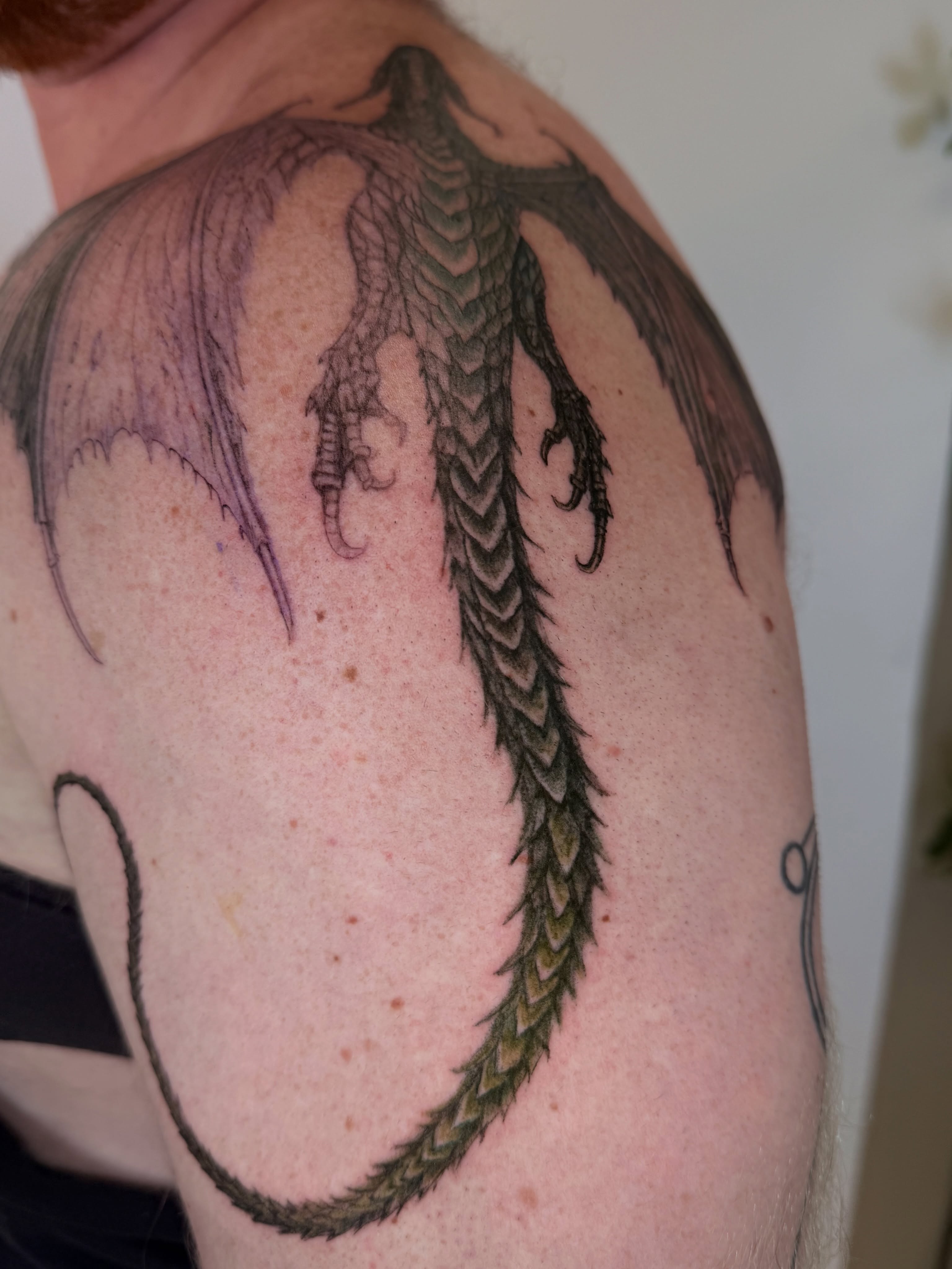 Dragon black and grey tattoo on the shoulder by Yuri Chloe Ngo Tattoo Artist