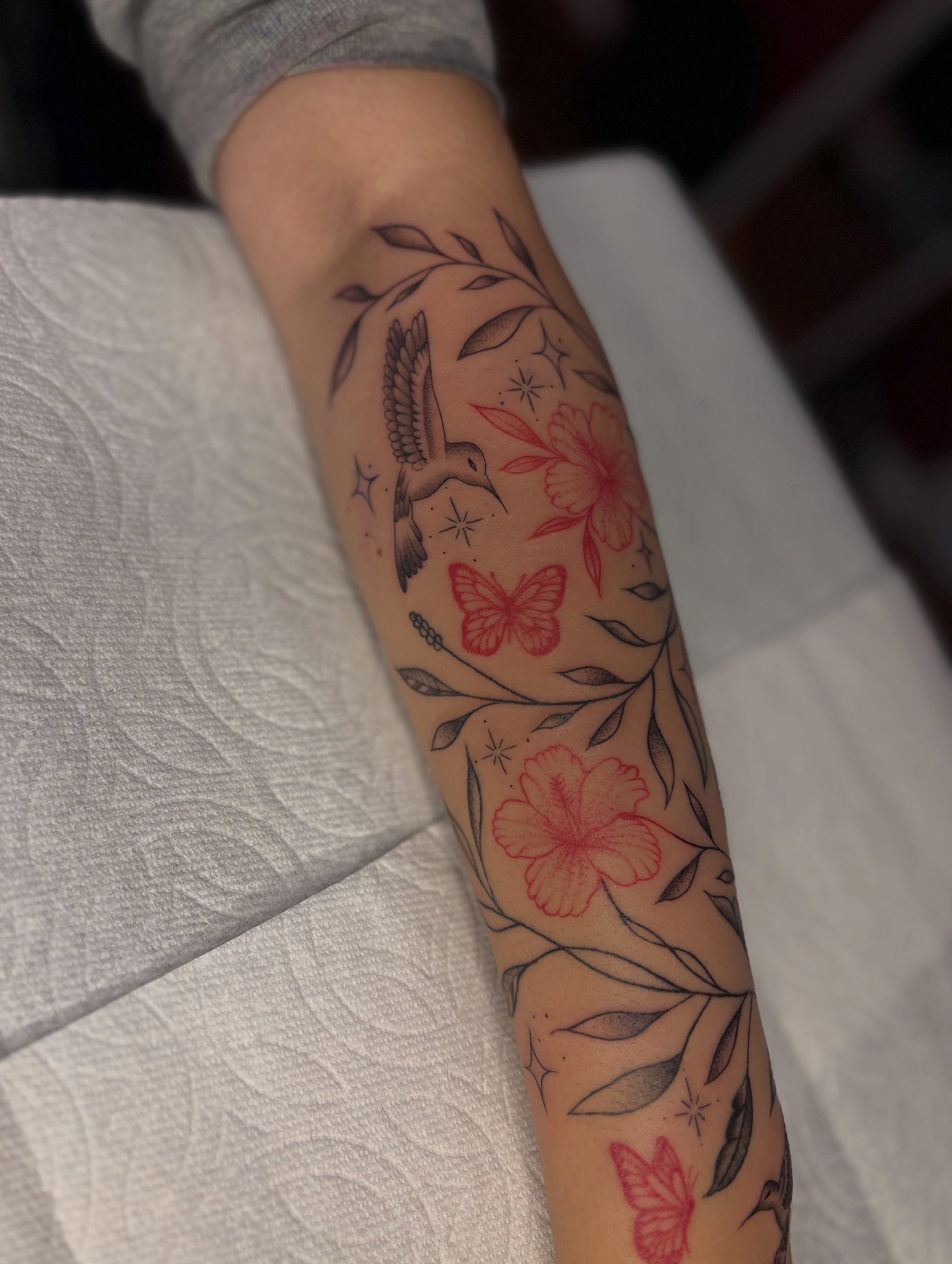 Floral and bird new school tattoo on the forearm by the ink witch ๐ฎ๐ค๐