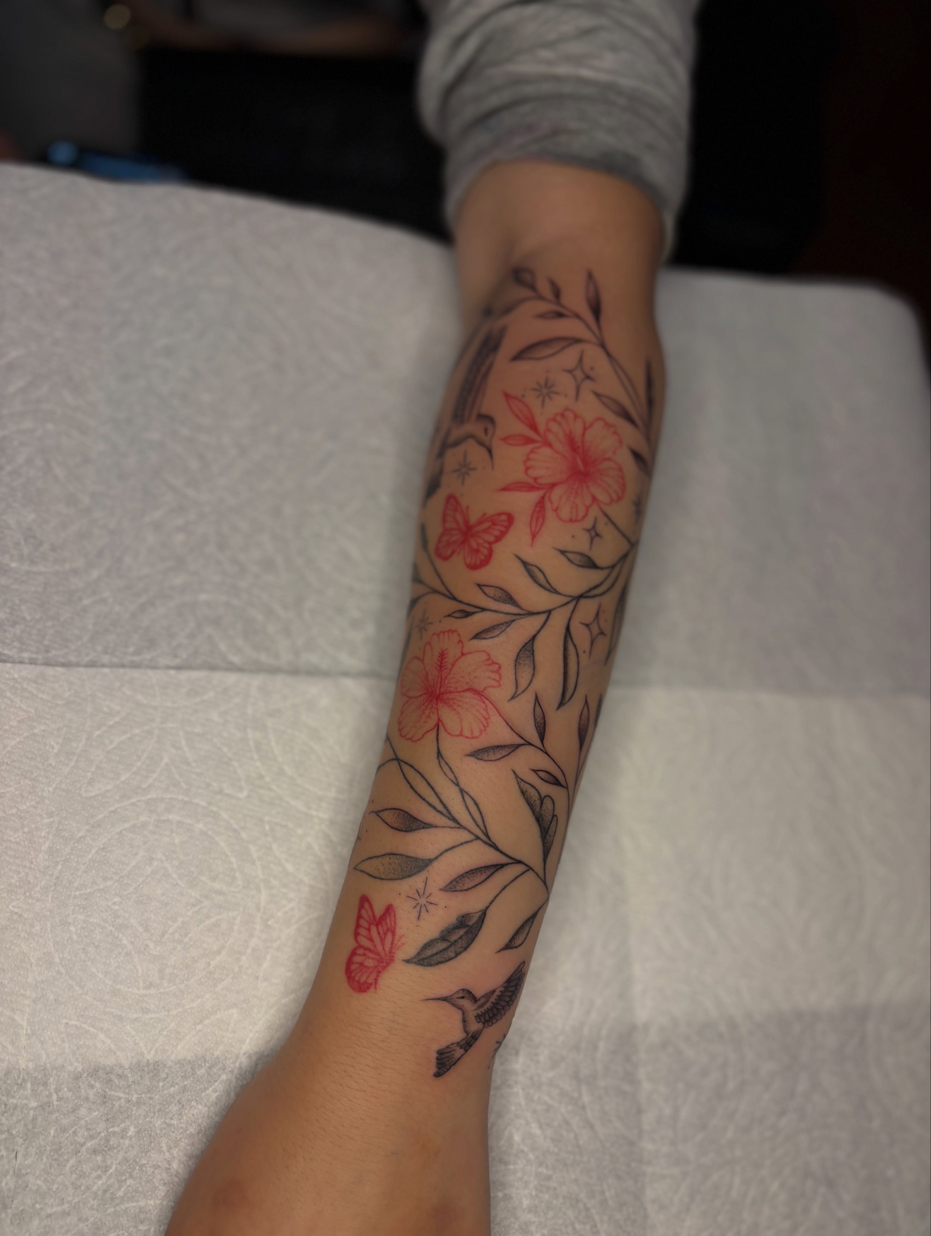 Floral and butterfly new school tattoo on the forearm by the ink witch ๐ฎ๐ค๐