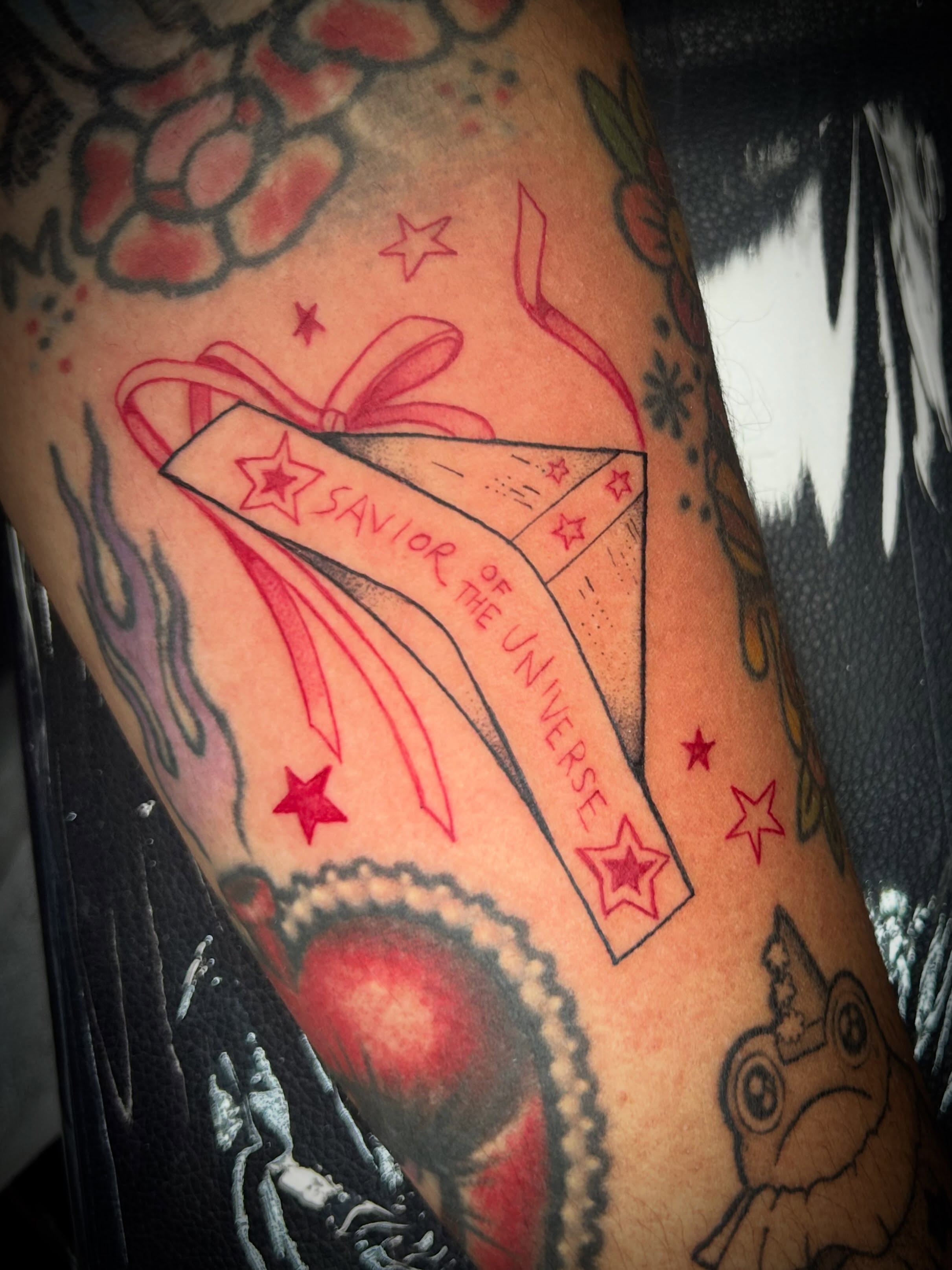 Book with ribbon American traditional tattoo on the forearm by ✶ 𝓑𝓲𝓽𝓮𝓼𝓲𝔃𝓮𝓭 𝓘𝓷𝓴 ✶, Buford, Georgia