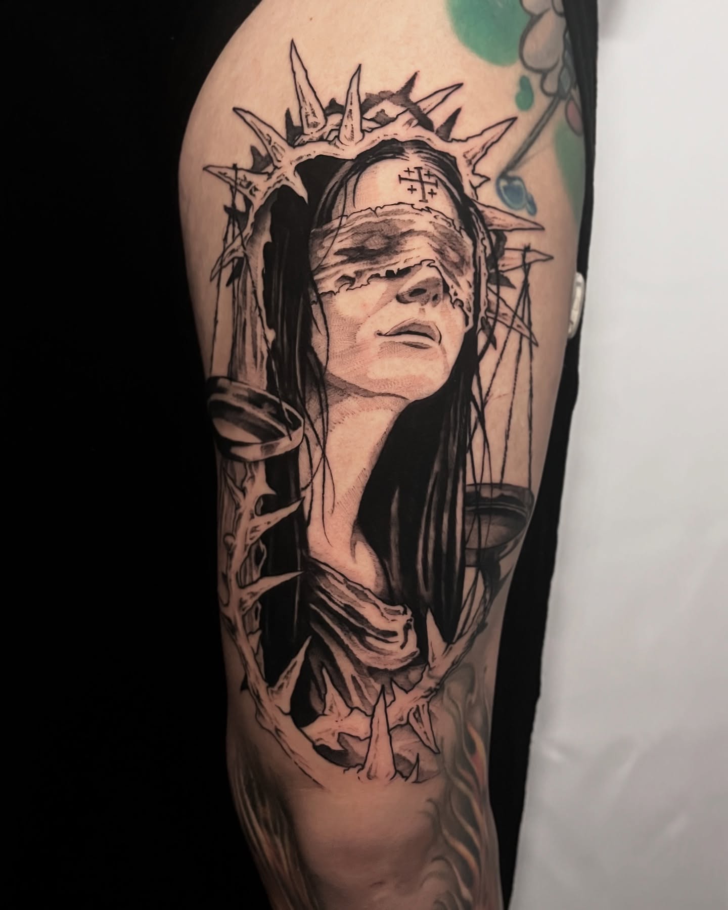 Blindfolded woman realism tattoo on the forearm by Cameron Jenkins
