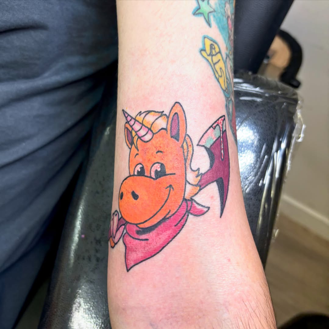 Unicorn new school tattoo on the forearm by Taylor  Thompson