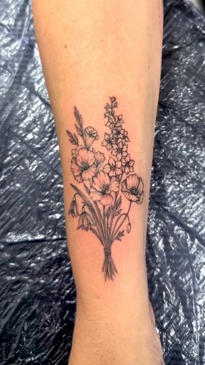 Bouquet of flowers fine line tattoo by Ink About Me - Amanda’s Fine Lines