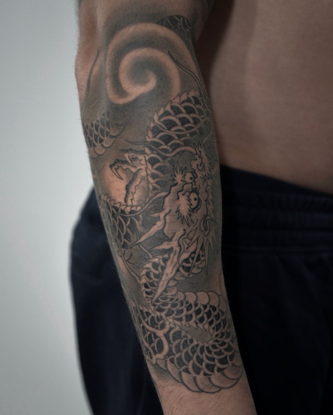 Mermaid and dragon japanese irezumi tattoo on the forearm by zak brochu, Windsor, Ontario