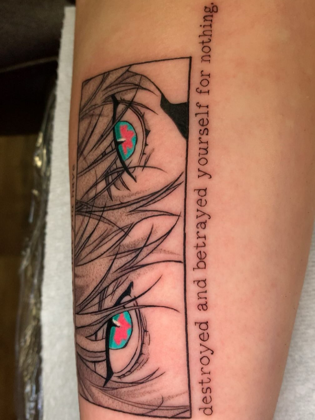 Anime eyes anime tattoo on the forearm by Maddie Rees