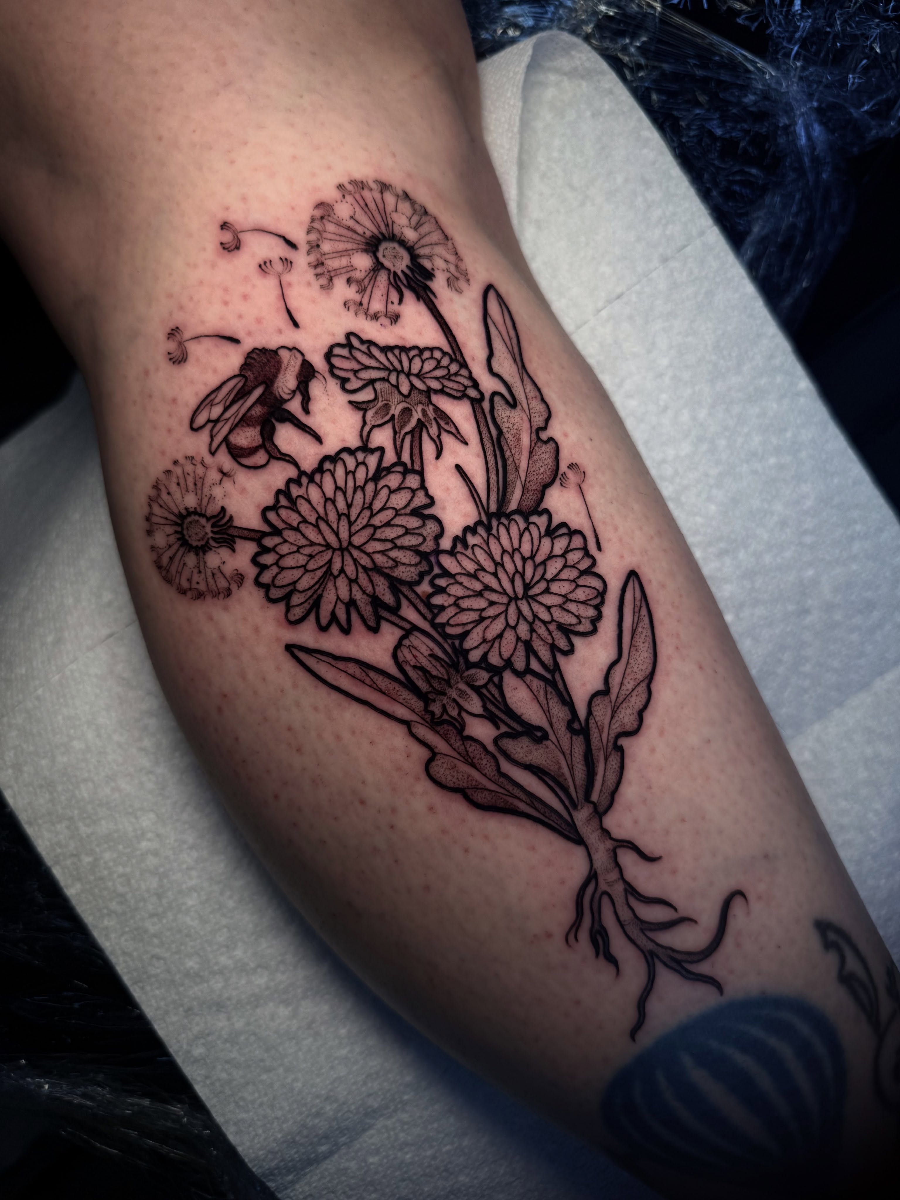Flowers and bee black and grey tattoo on the forearm by H A N N A H, Colorado Springs, Colorado