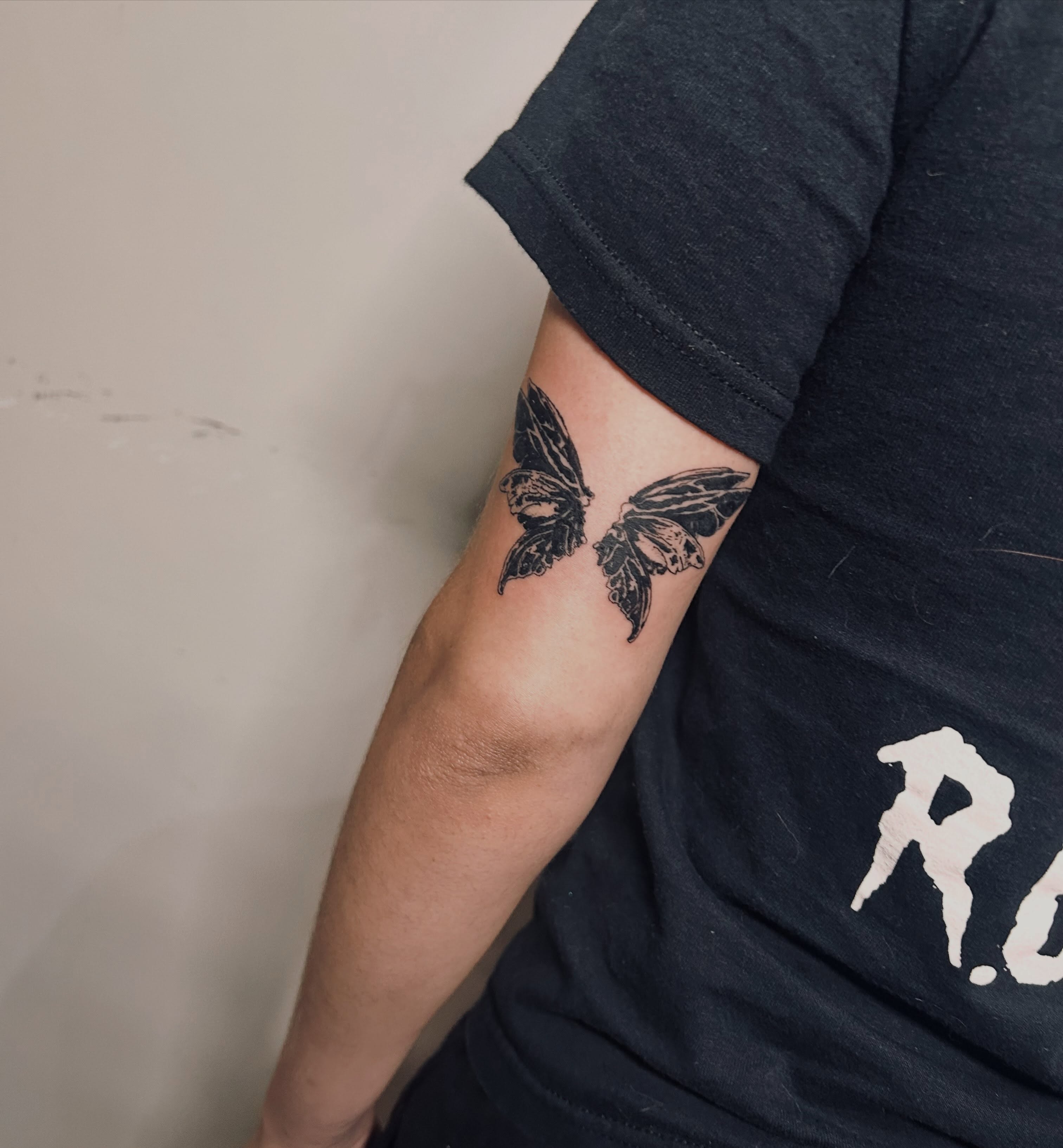 Butterfly black and grey tattoo on the forearm by Miss Katie