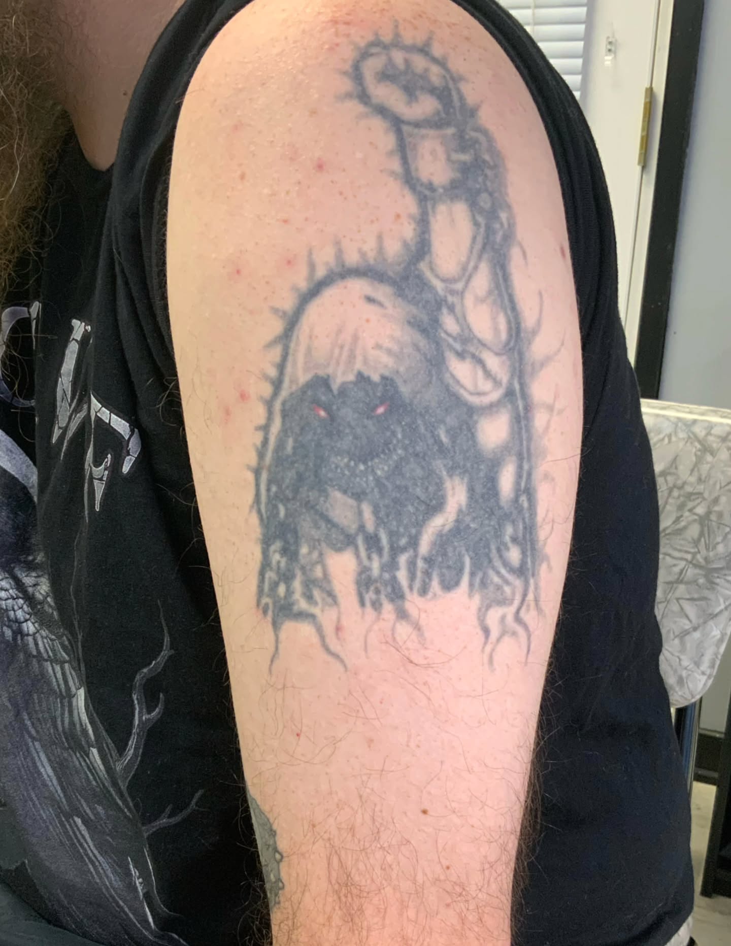 Demon dark realism tattoo on the shoulder by Zach Mullins