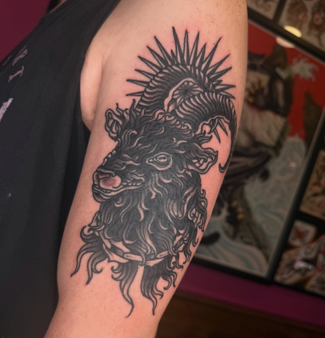 Beast head black and grey tattoo on the forearm by Mika Clairissa