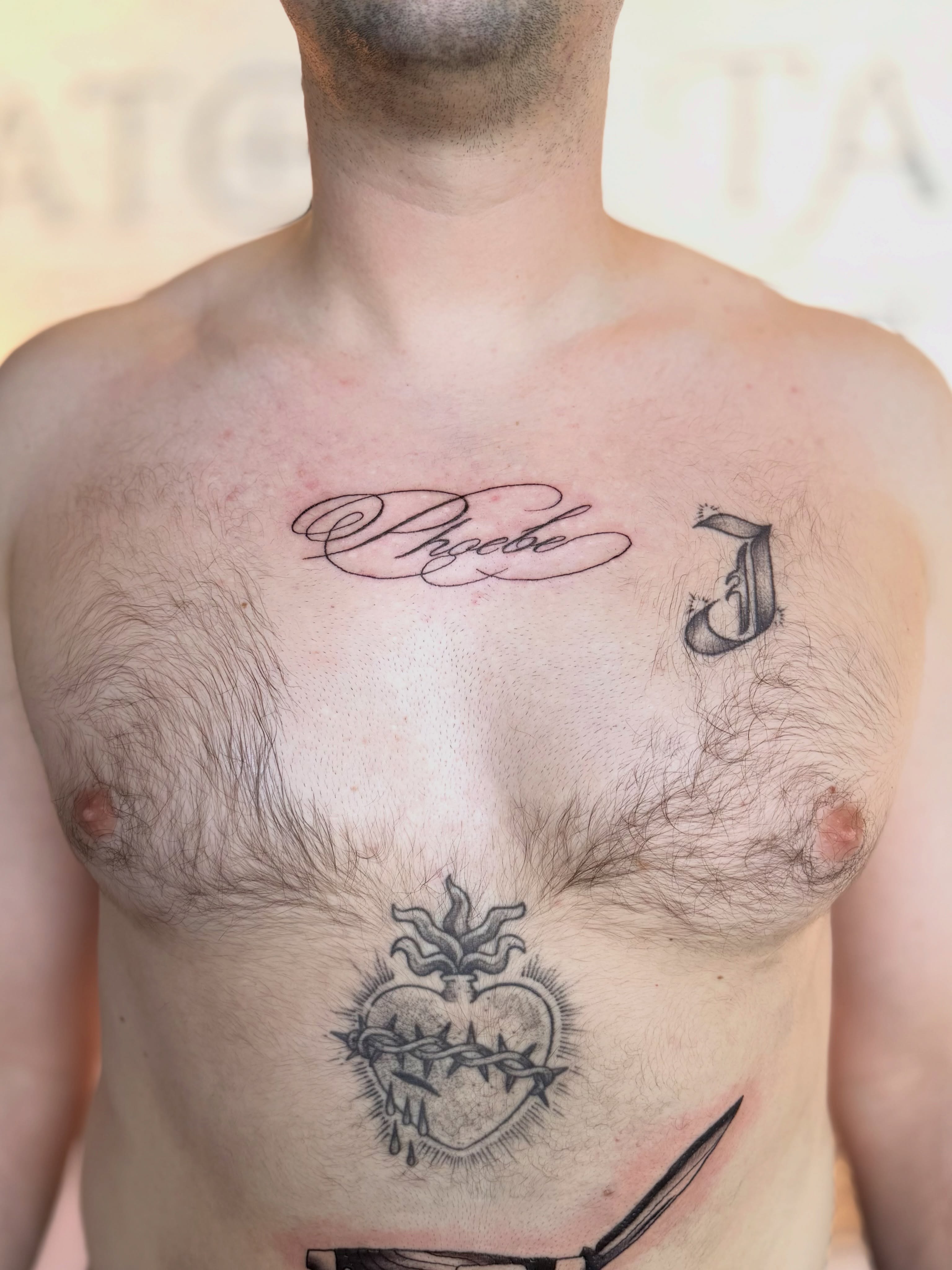 Heart with crown of thorns black and grey tattoo on the chest by Kyndall Lynn, Waxahachie, Texas