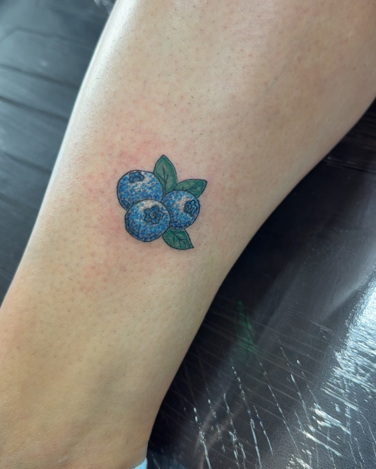 Blueberries realism tattoo on the forearm by Felicia Lee, Des Moines, Iowa