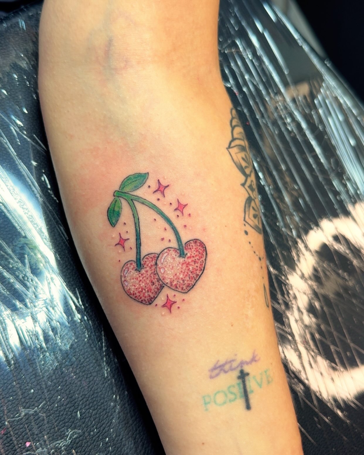 Cherry dotwork tattoo on the forearm by Felicia Lee, Des Moines, Iowa
