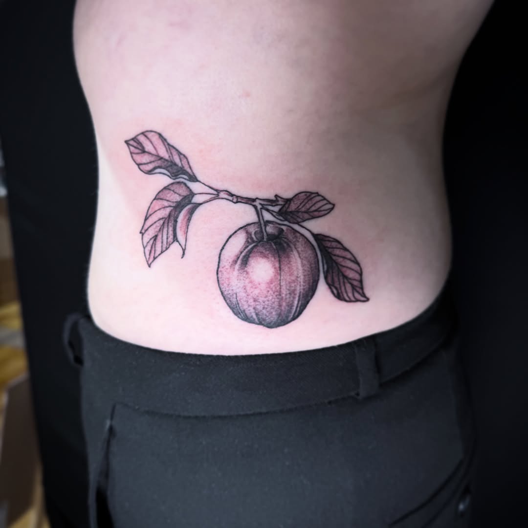 Plum realism tattoo on the ribs by 🏵