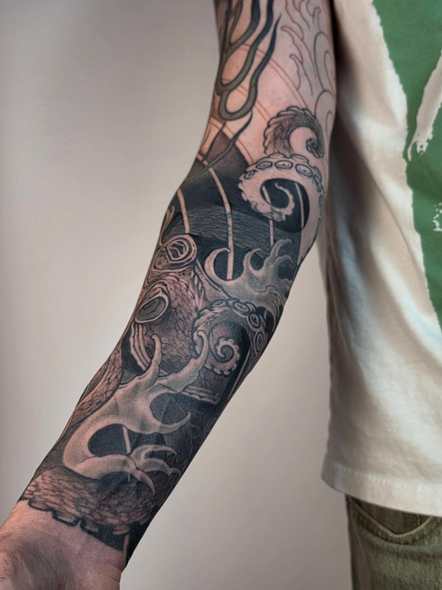 Octopus and waves realism tattoo on the forearm by Tattoos.byDahlia, Austin, Texas