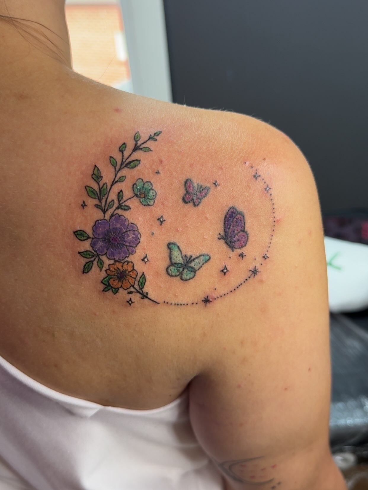 Flowers and butterflies dotwork tattoo on the shoulder by Felicia Lee, Des Moines, Iowa