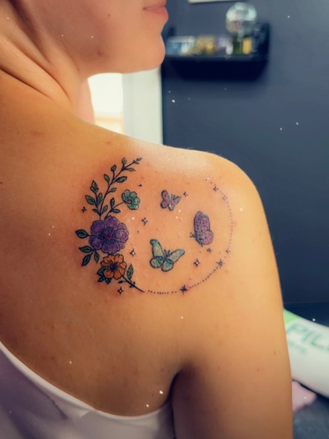 Flowers and butterflies dotwork tattoo on the shoulder by Felicia Lee, Des Moines, Iowa