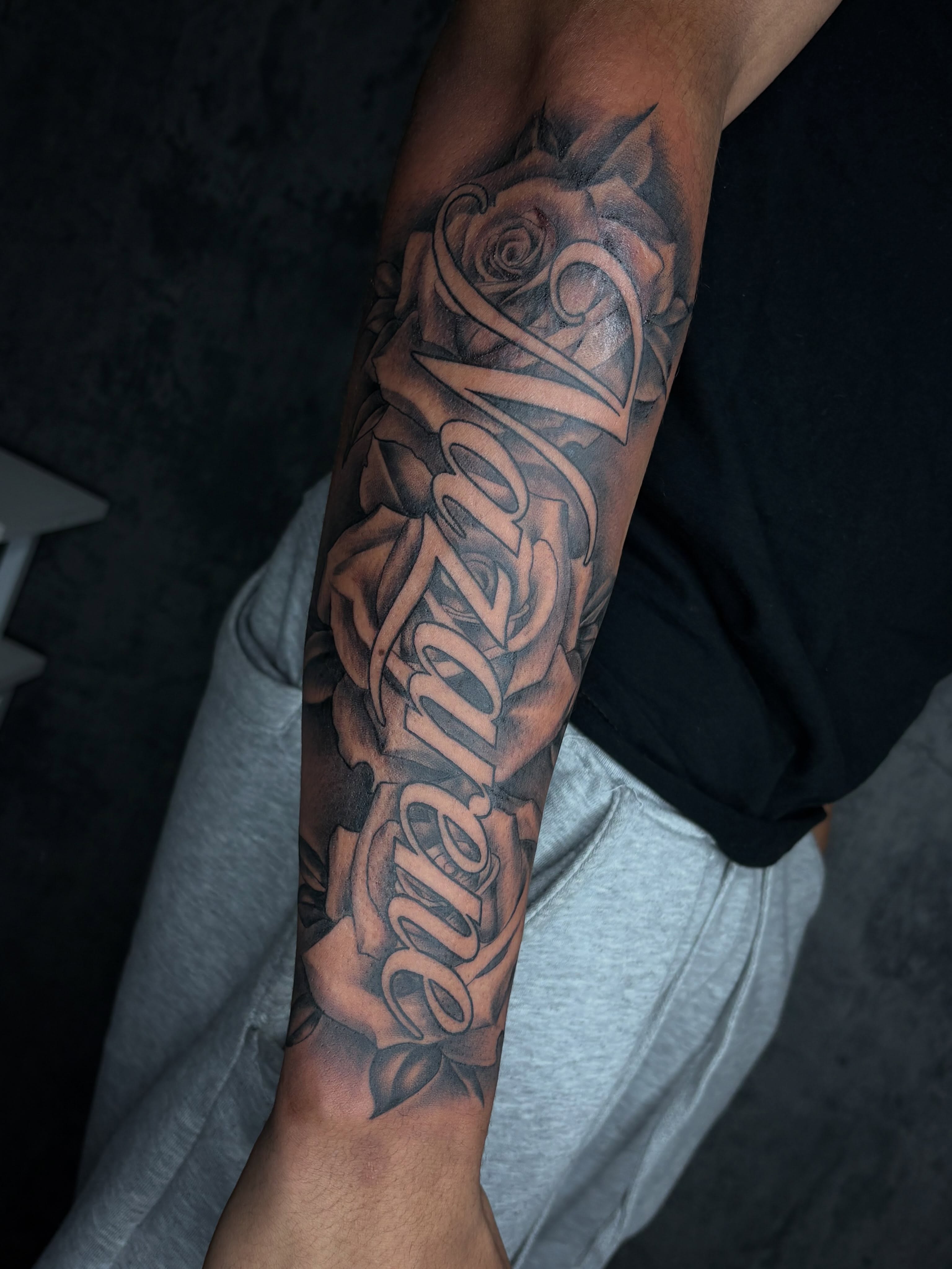 Roses and cursive script realism tattoo on the forearm by ✧ Dallas Tattoo Artist  ✧
