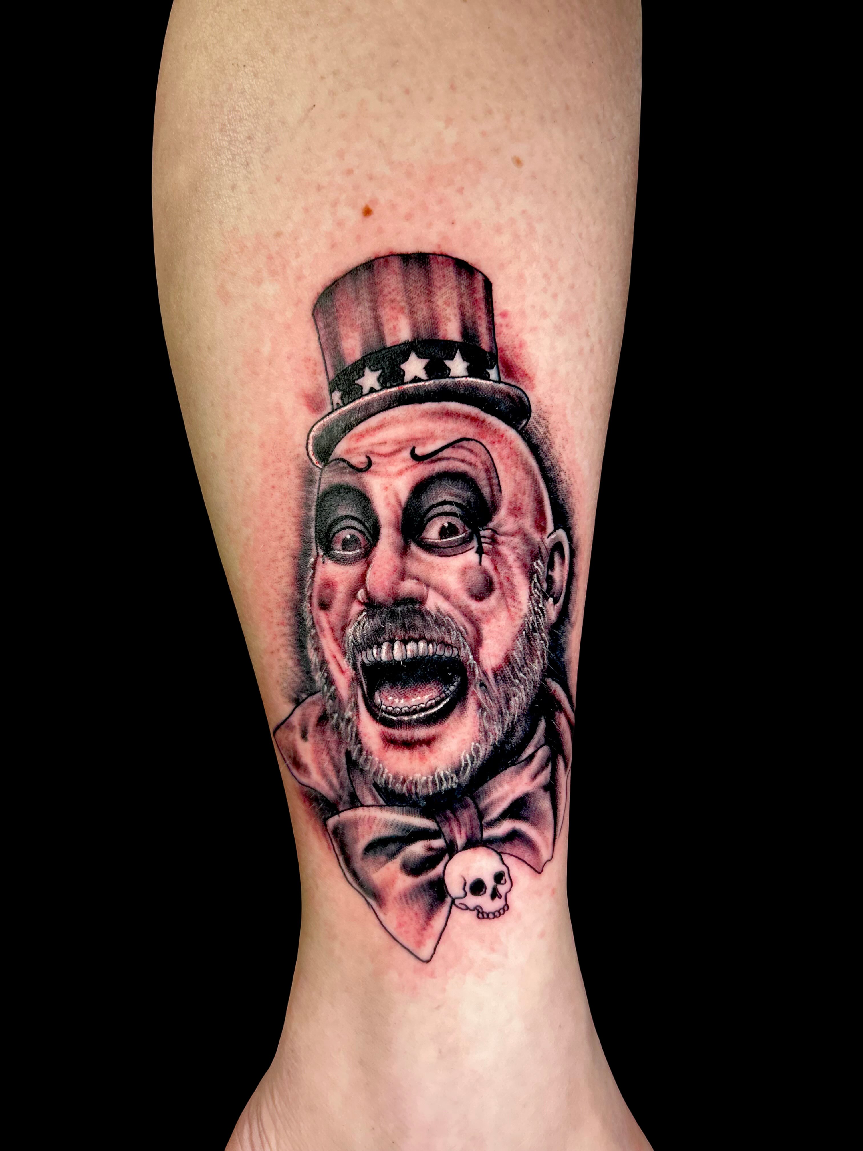 Clown head realism tattoo on the forearm by Austin Young