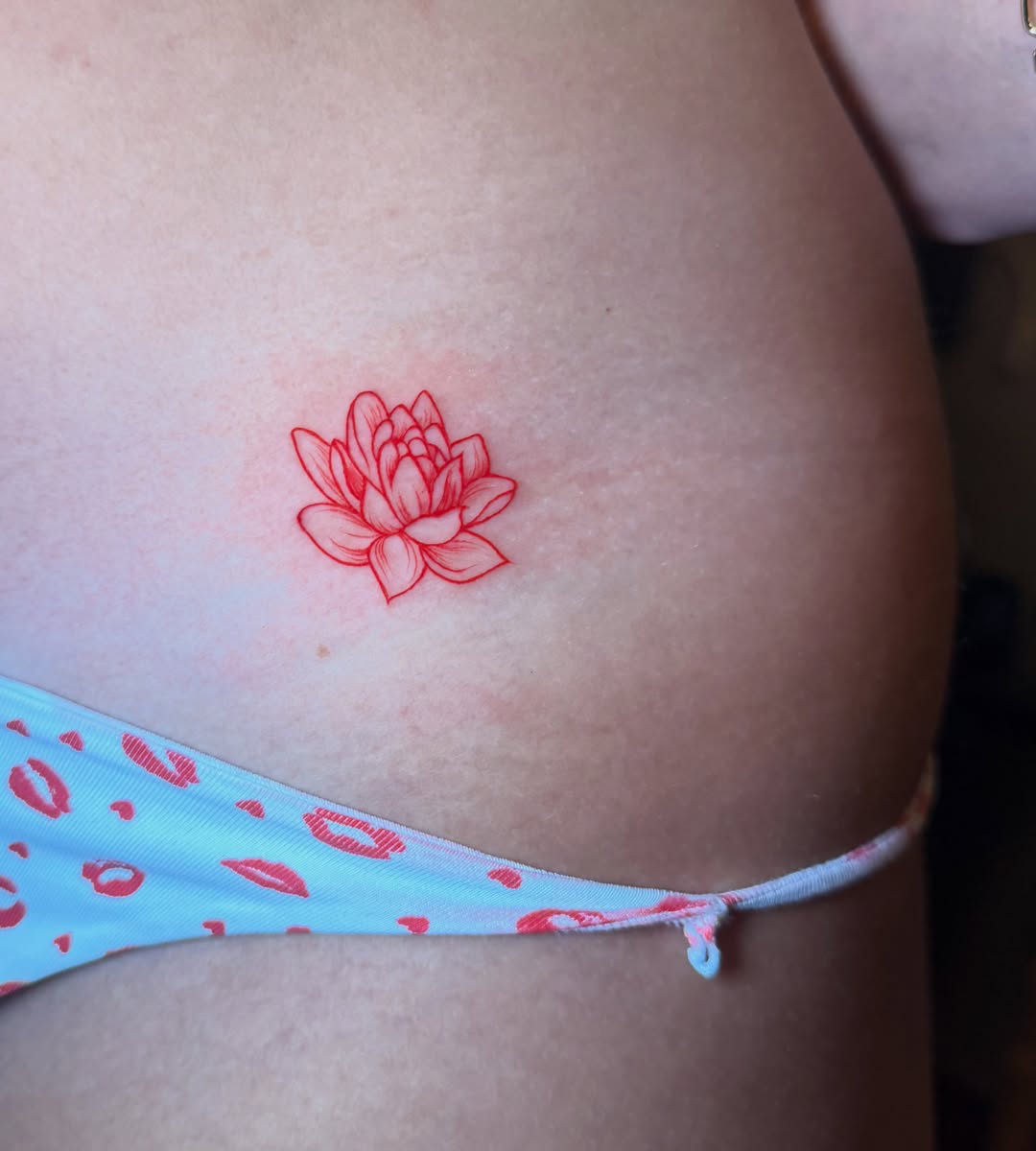 Lotus flower fine line tattoo on the thigh by tattoo artist (mollz)