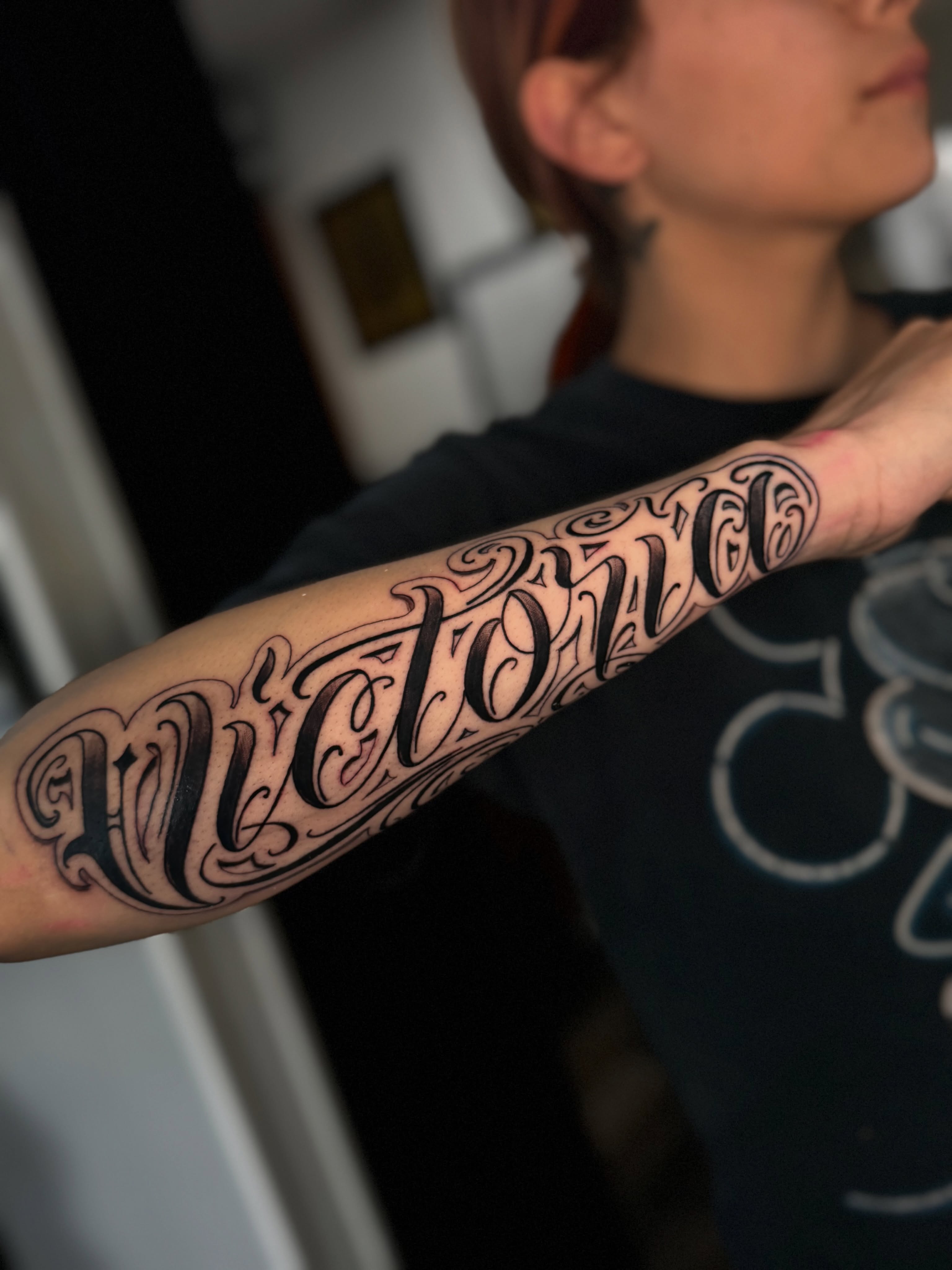 Script lettering lettering script tattoo on the forearm by Miguel Garcia