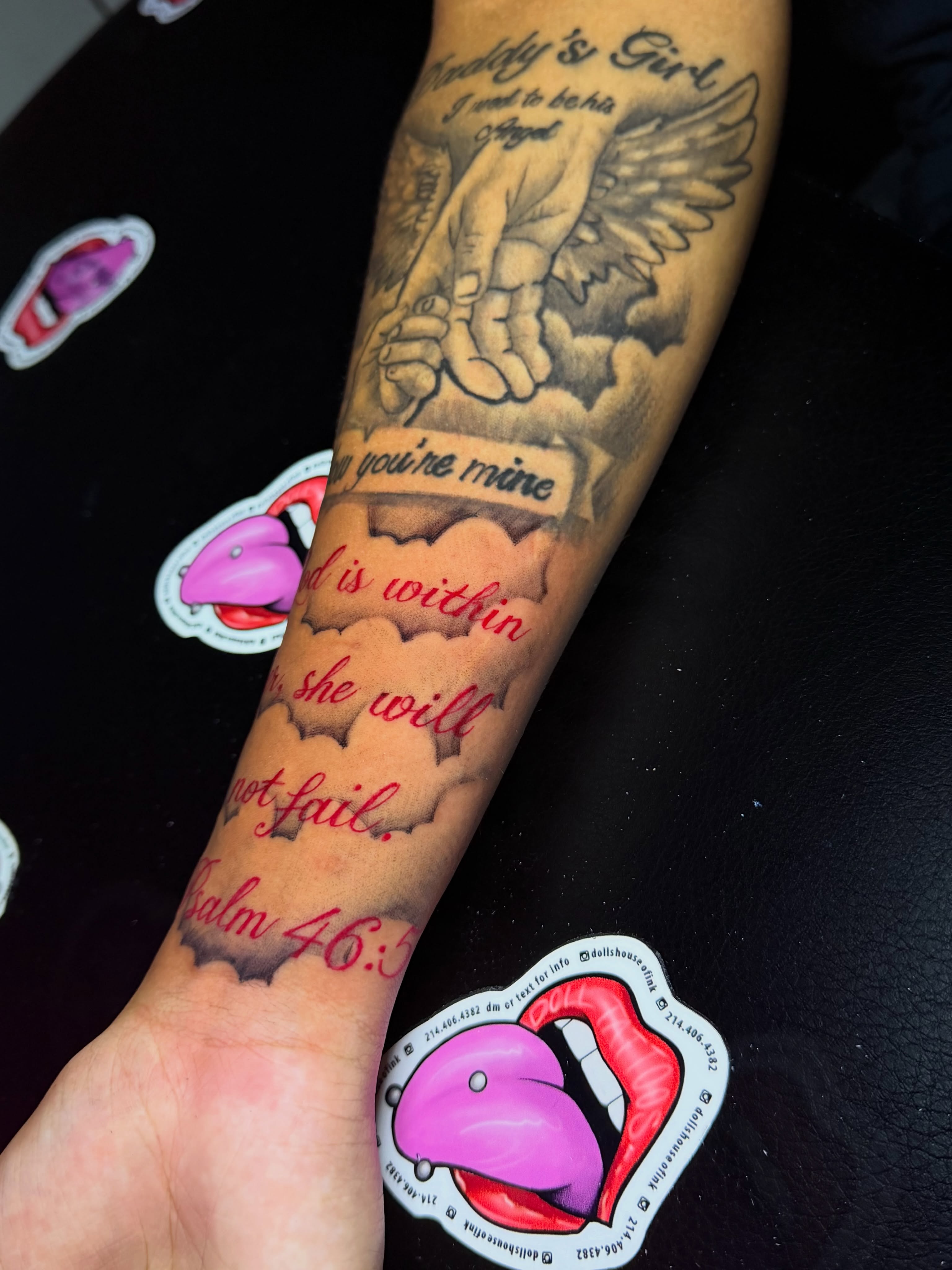 Angelic hand holding child American traditional tattoo on the forearm by Doll The Tattoo Artist, Addison, Texas