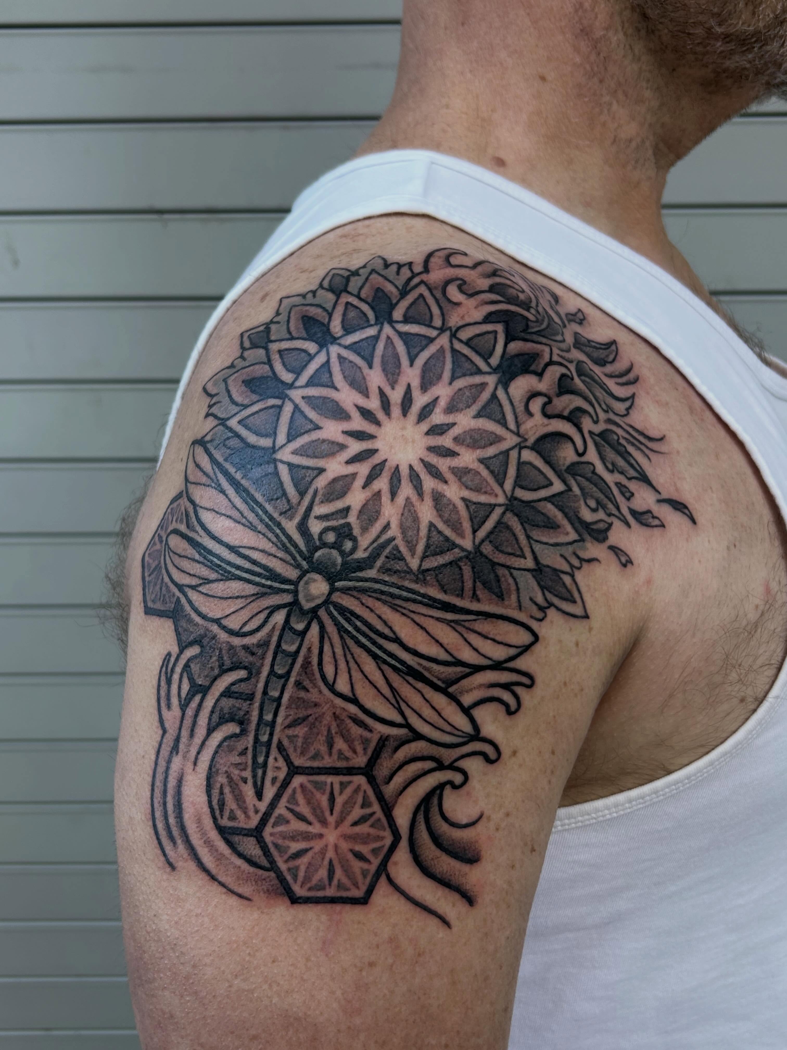Geometric mandala geometric tattoo on the shoulder by Ravi Chandra, Mount Shasta, California