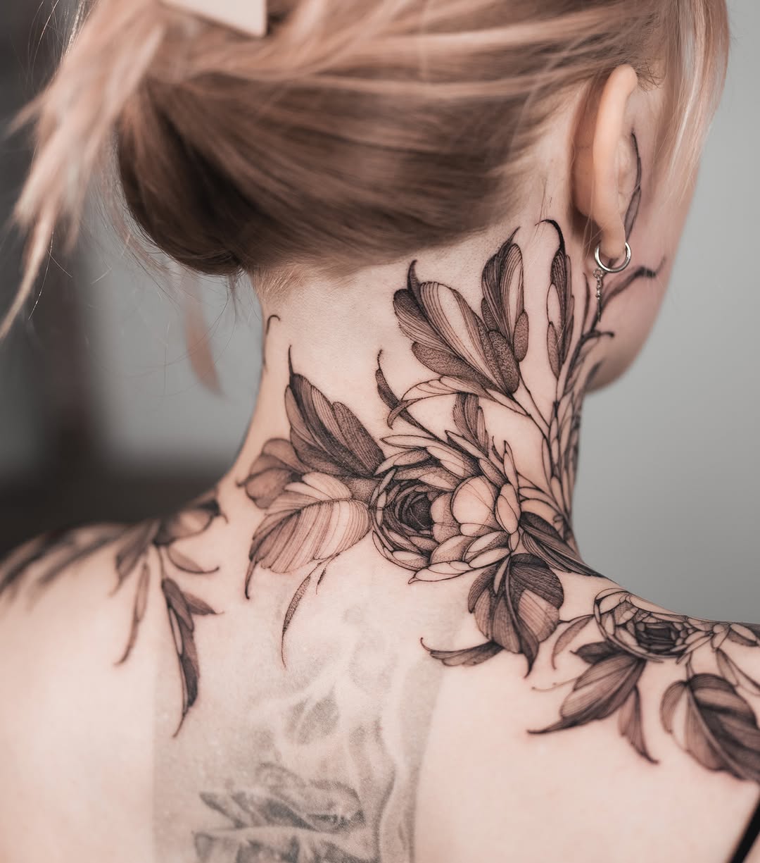 Floral black and grey tattoo on the neck by Yuliia Babych tattoo AUSTIN