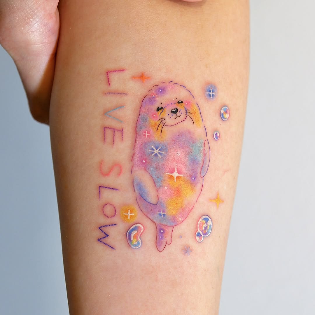 Seal watercolor tattoo on the forearm by 타투 Seon 컬러타투