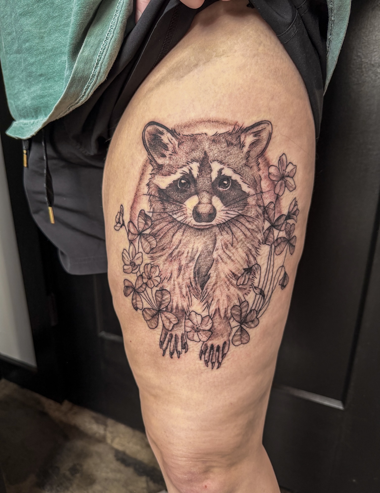 Raccoon black and grey tattoo on the thigh by Reagan Sutton