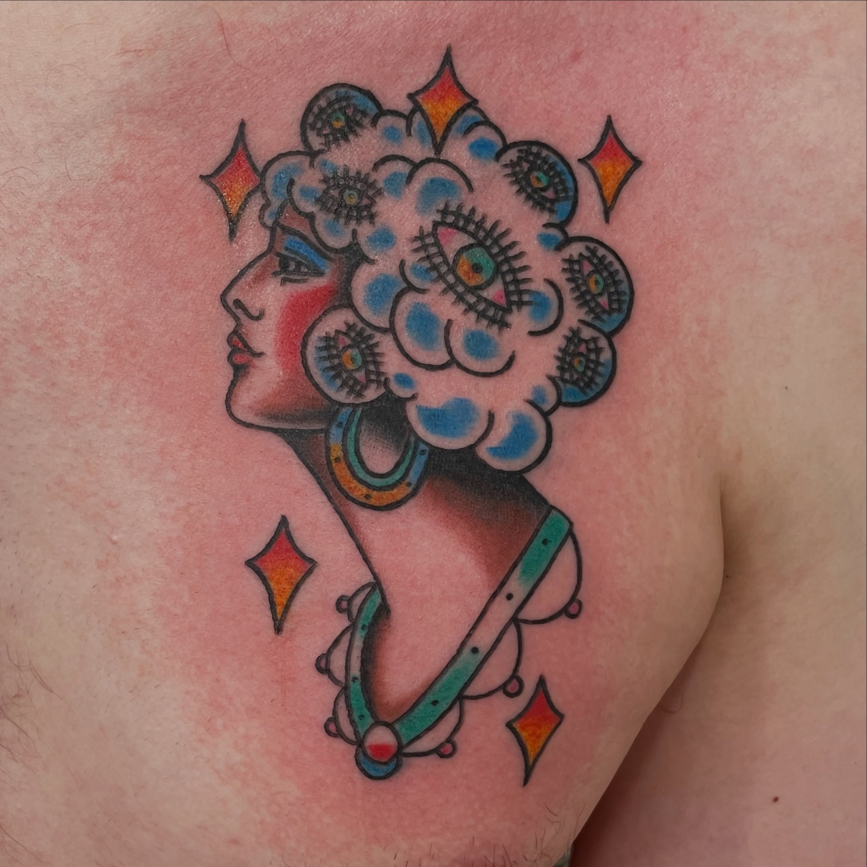 Floral portrait American traditional tattoo on the shoulder by Greg De Hoot, Youngsville, North Carolina