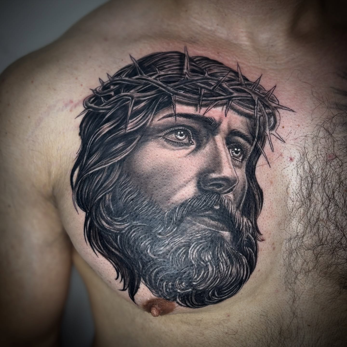 Jesus Christ realism tattoo on the chest by Adrian Ram 🇬🇾🇵🇭