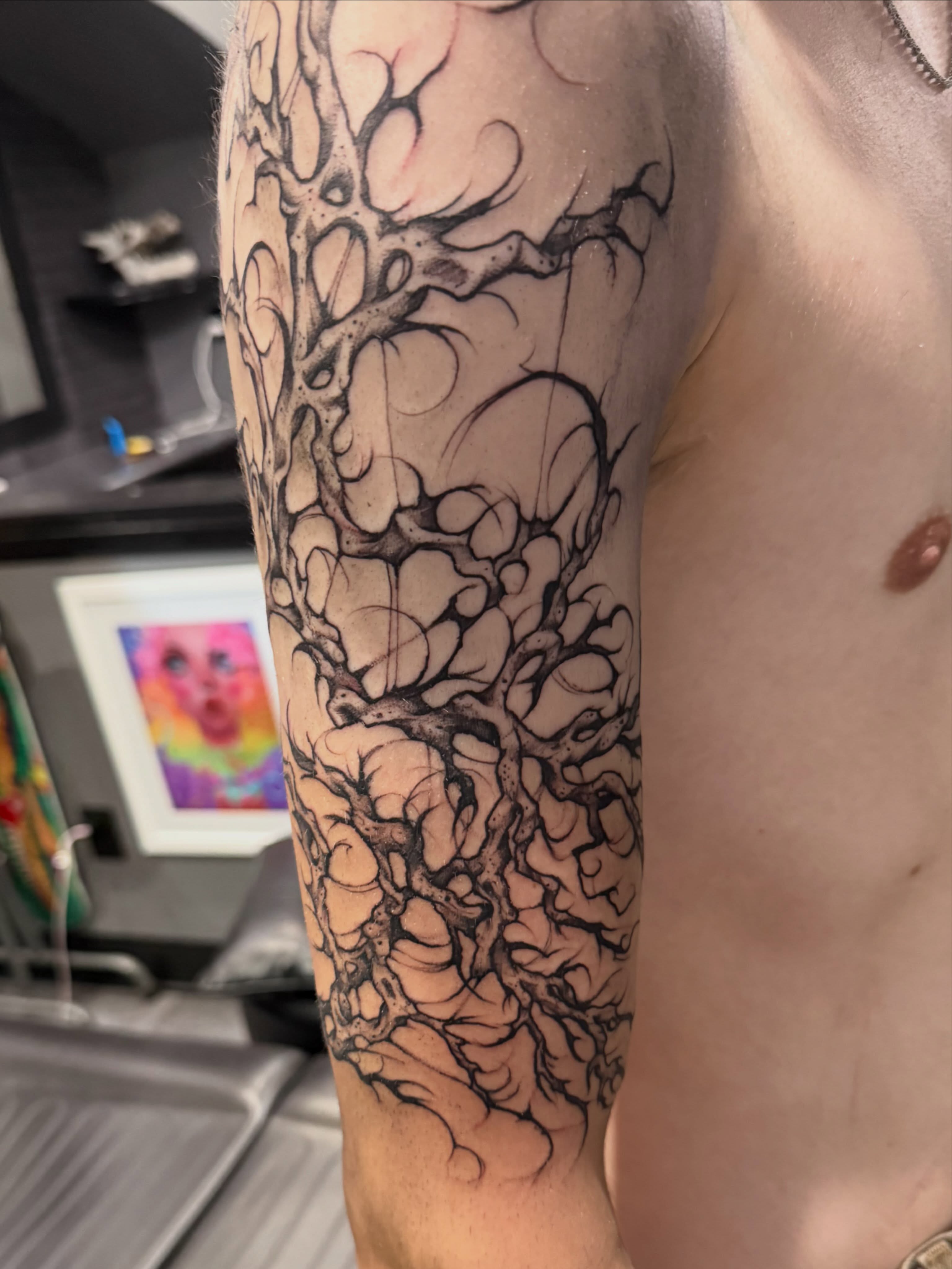 Abstract tree black and grey tattoo on the forearm by Courtney