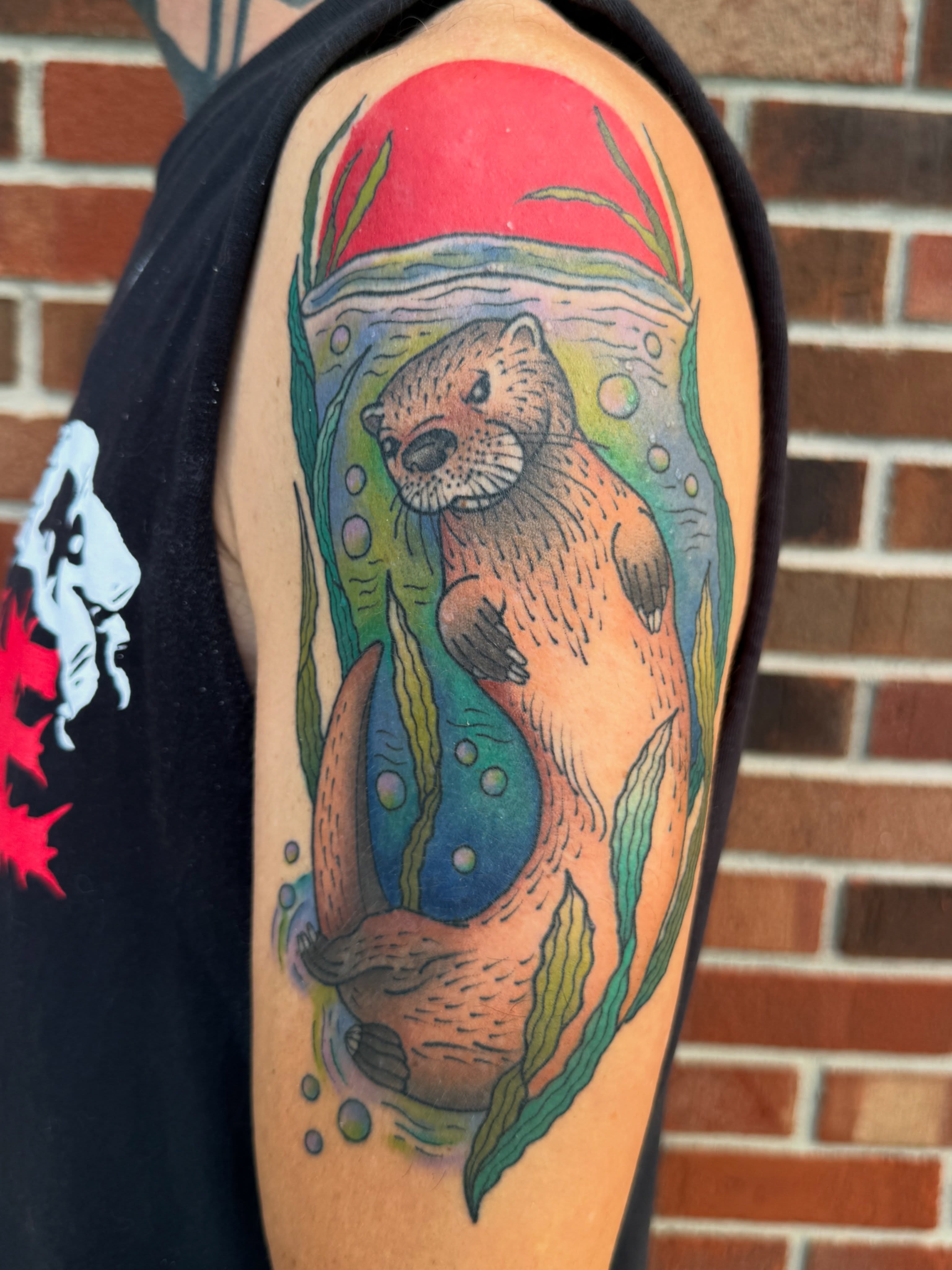 Otter American traditional tattoo on the upper arm by 🍄Annie Burkhard🍄, Indianapolis, Indiana