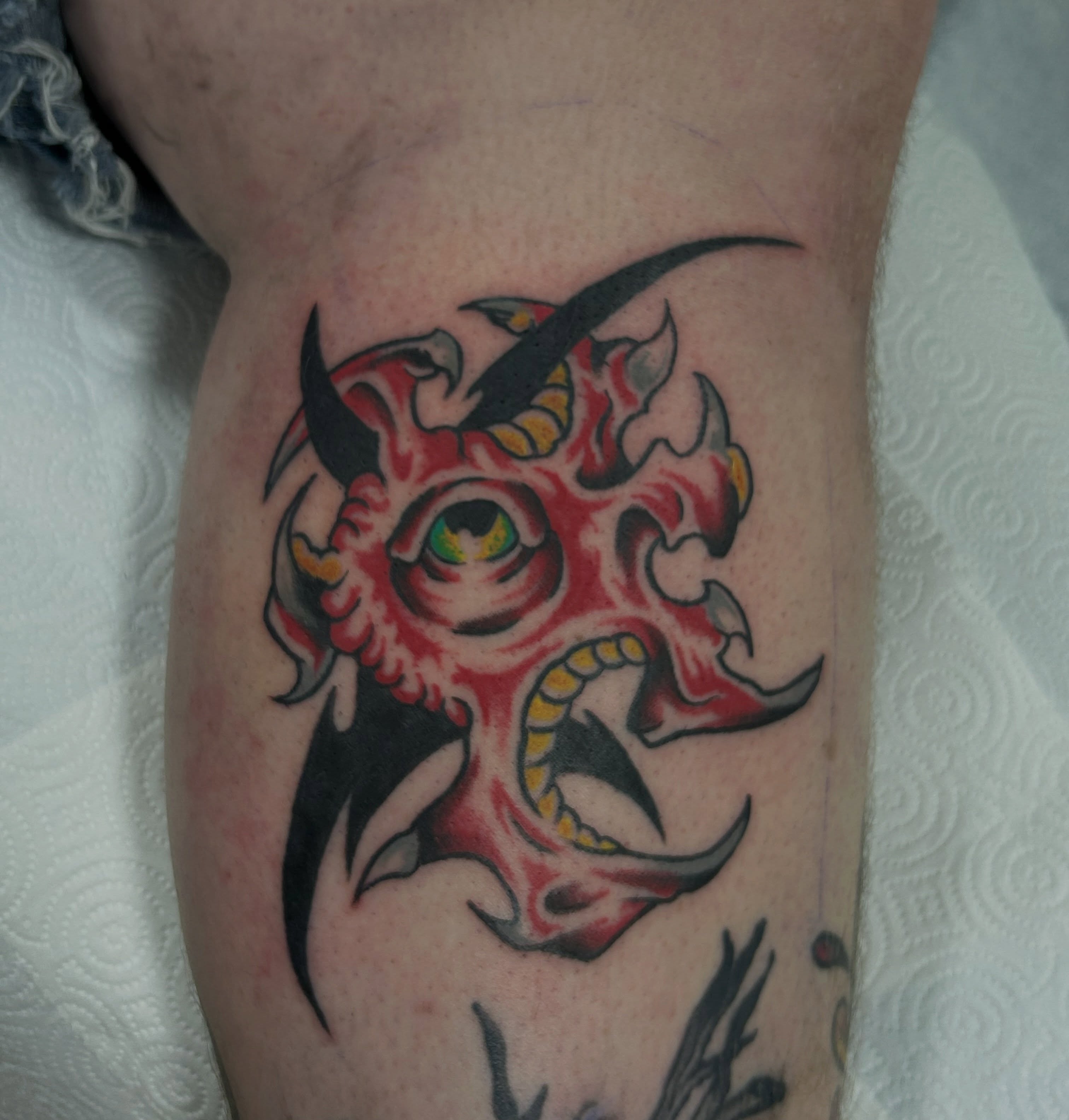 Demon face neo-traditional tattoo on the forearm by キノ 🦊