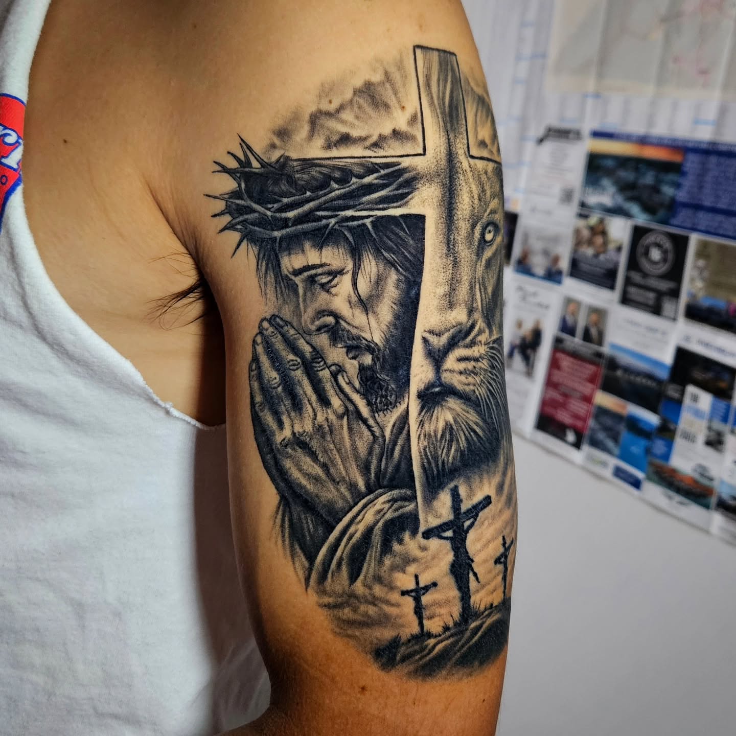 Religious scene realism tattoo on the forearm by Isaac Morales