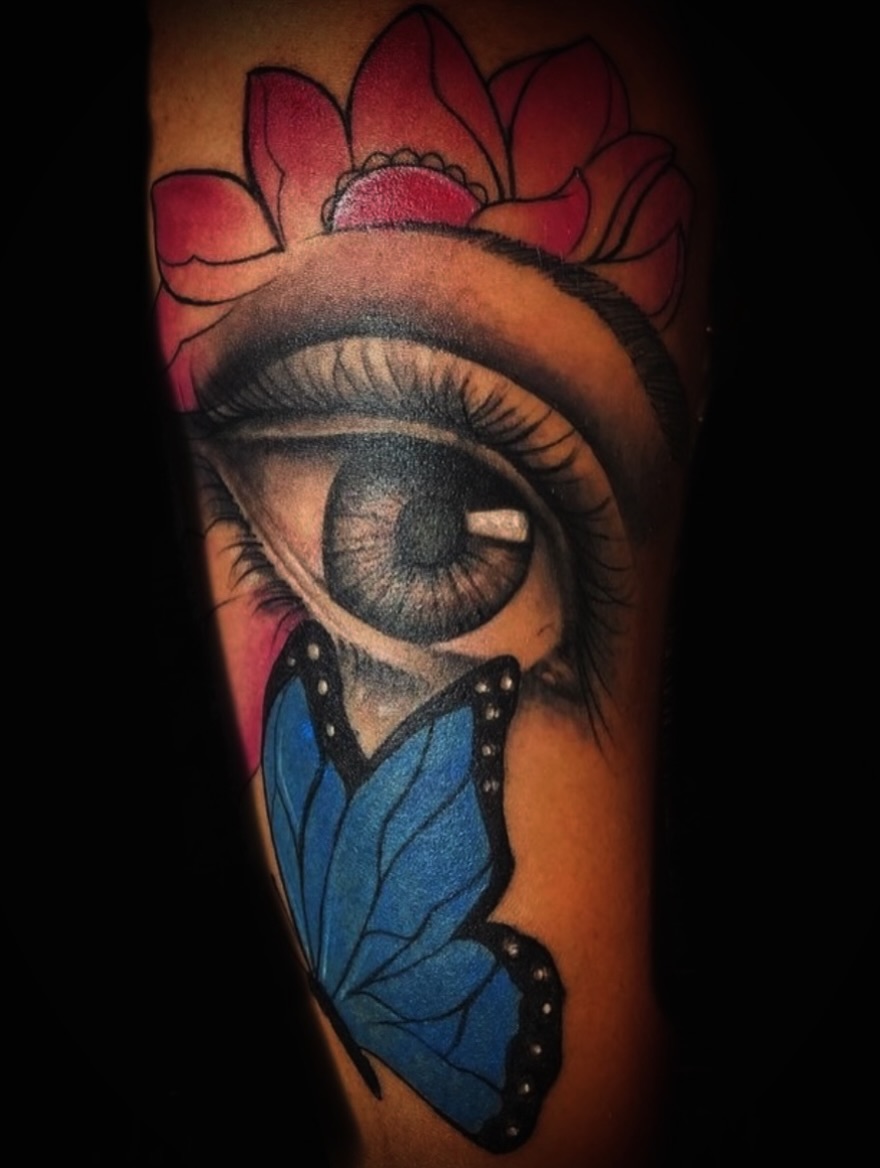 Eye with butterfly dotwork tattoo on the forearm by Devin Johnson, Forest Park, Georgia