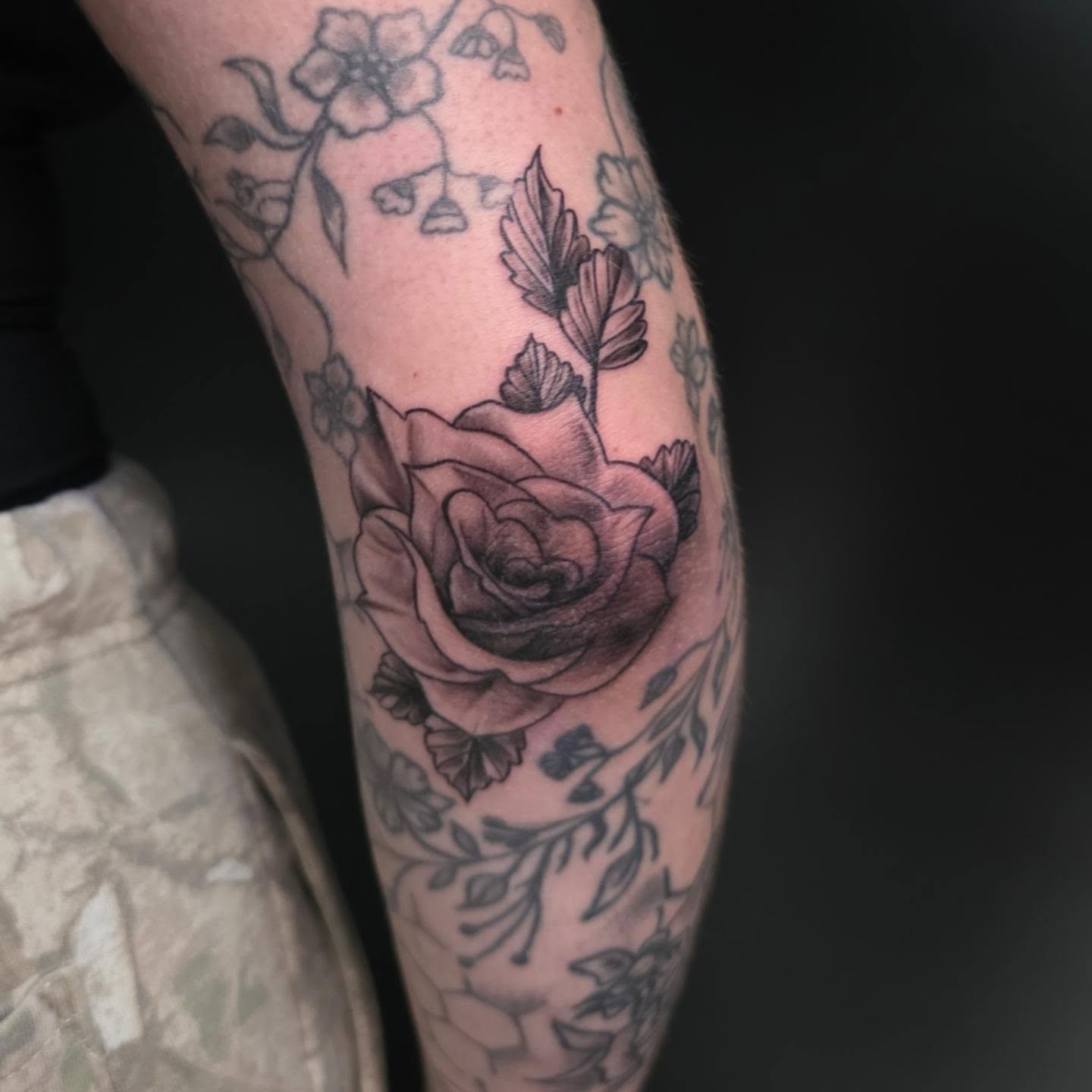 Rose black and grey tattoo on the forearm by Kosta