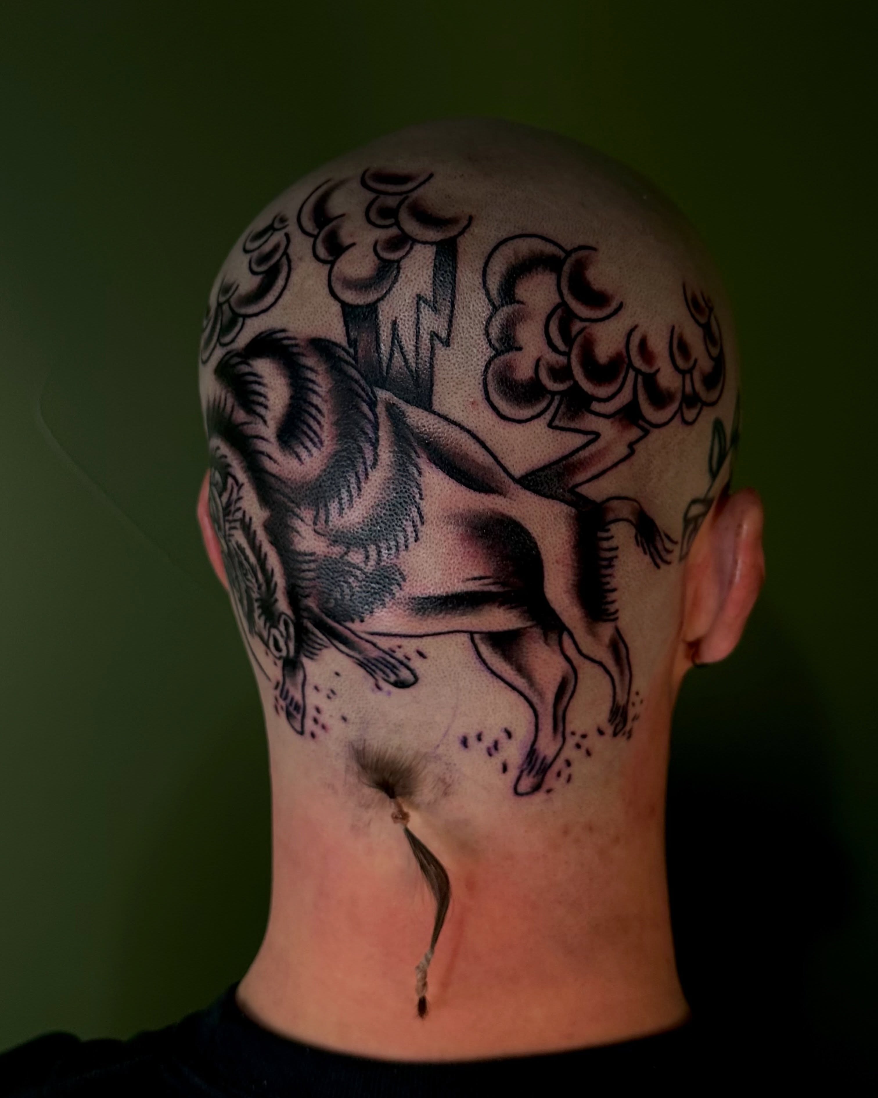 Horse and clouds black and grey tattoo on the head by Destiny Tolman