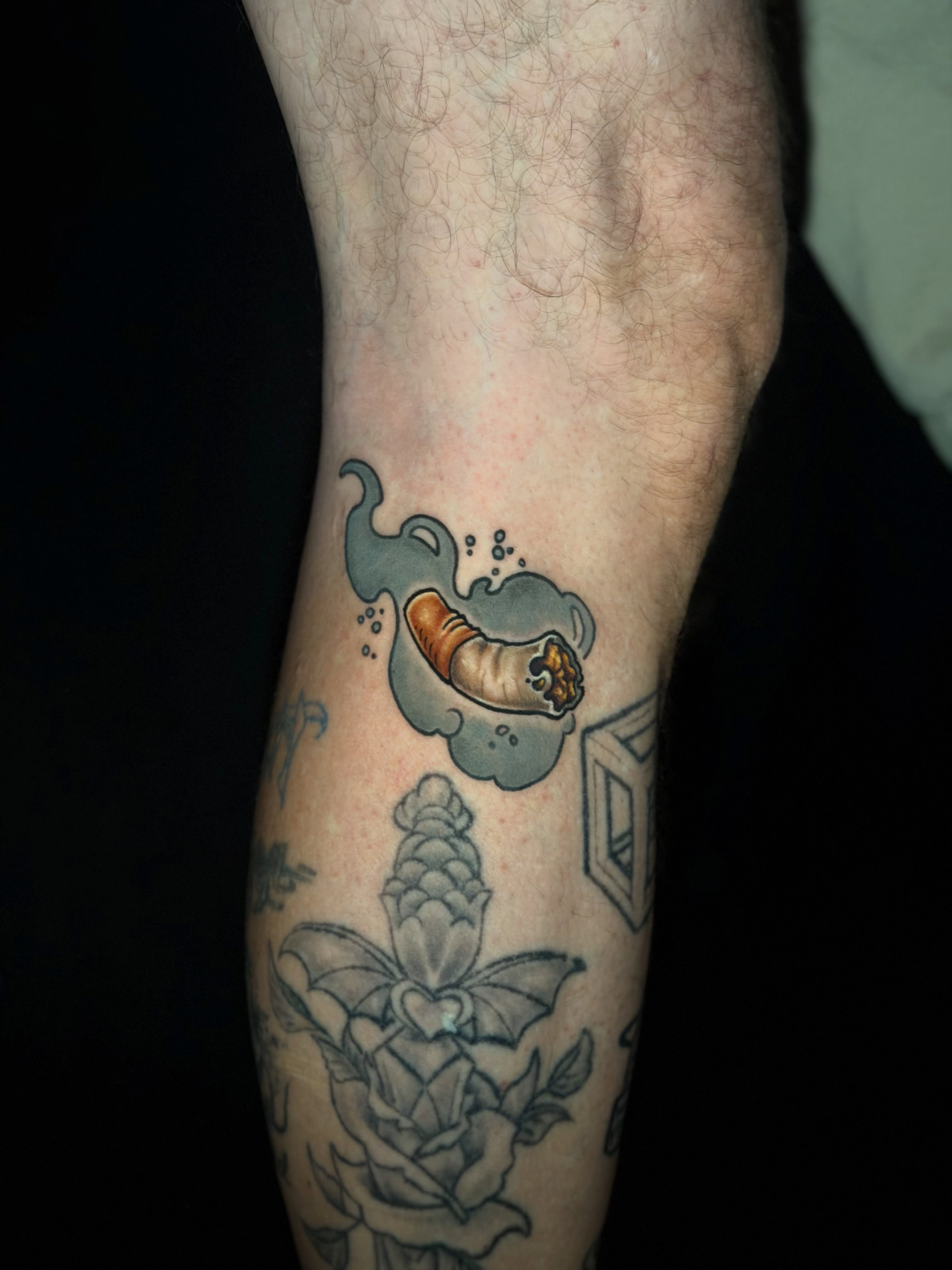 Smoking caterpillar American traditional tattoo on the forearm by Trista Bettfreund (Birdy)