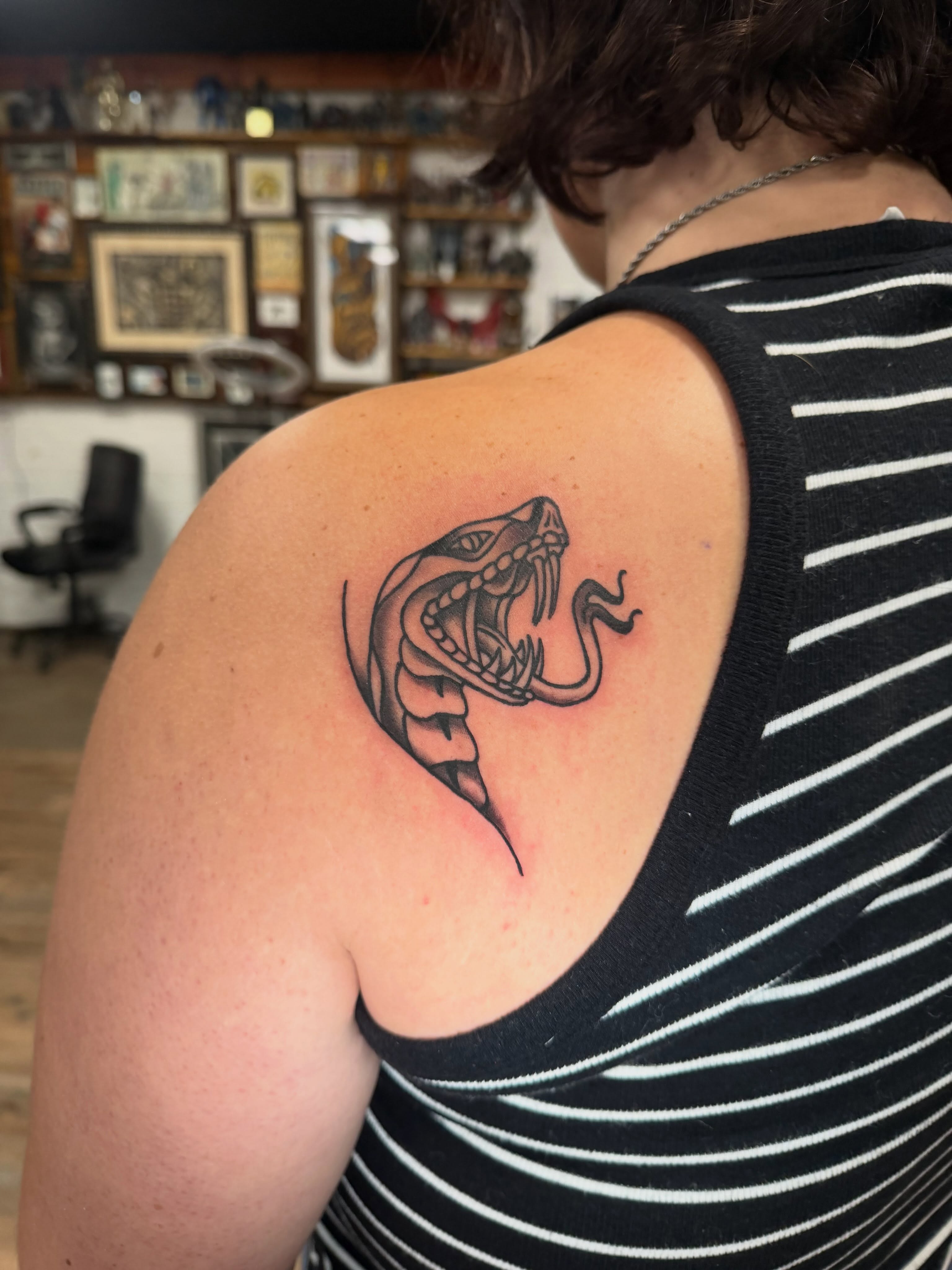 Snake black and grey tattoo on the shoulder by Trista Bettfreund (Birdy)