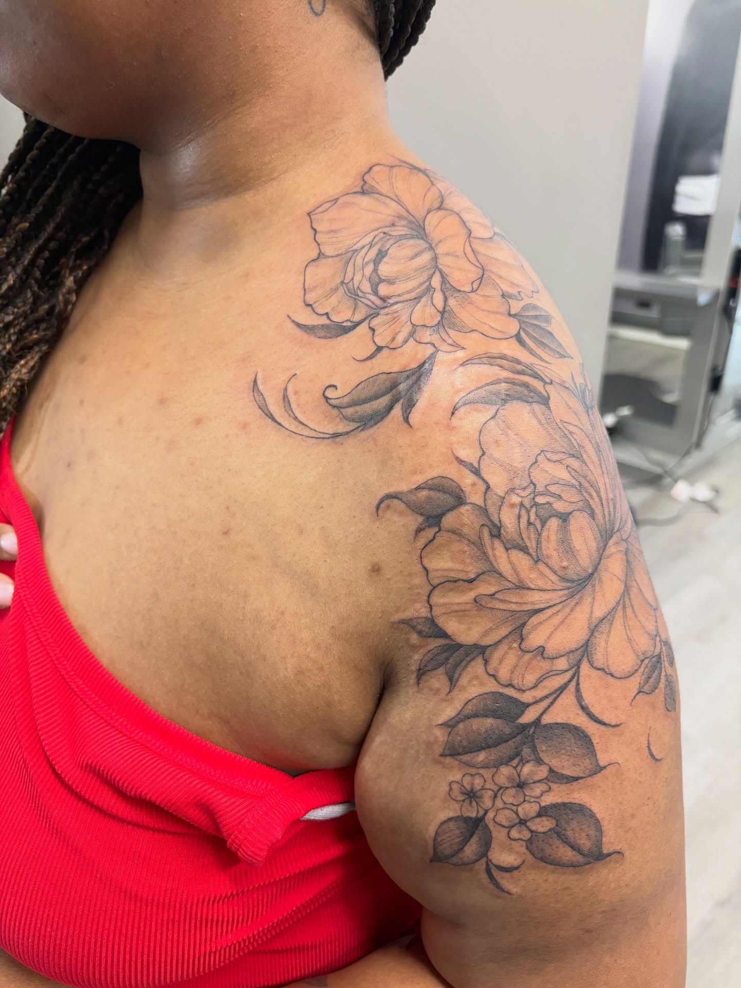 Peony flowers black and grey tattoo on the shoulder by Detroit Tattoo Artist