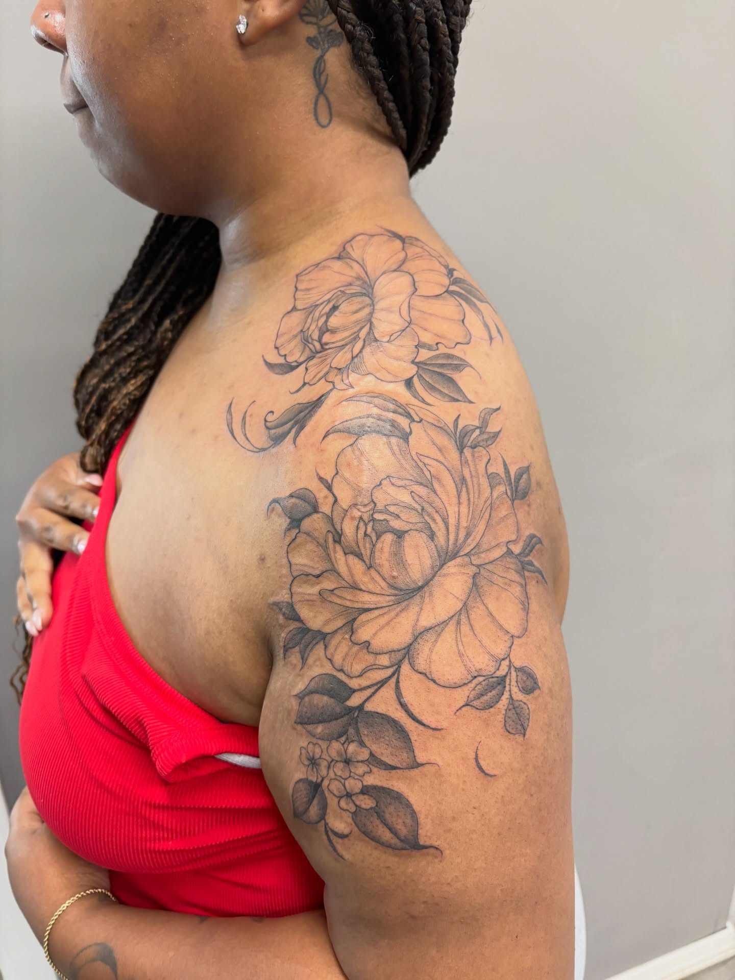 Floral bouquet black and grey tattoo on the shoulder by Detroit Tattoo Artist