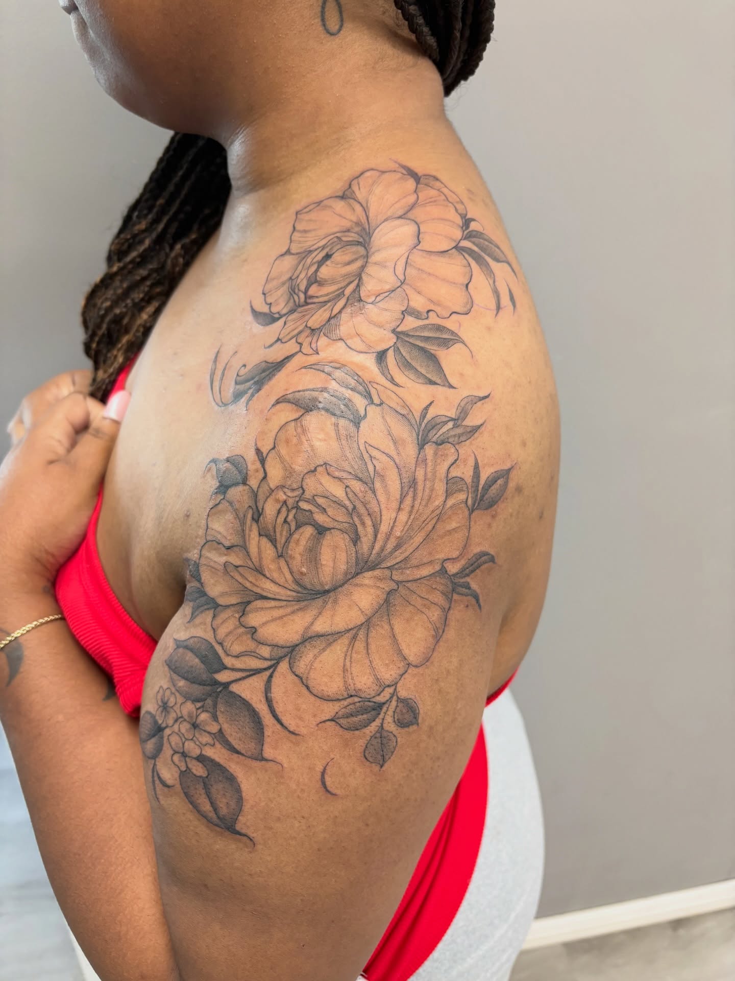 Floral bouquet black and grey tattoo on the shoulder by Detroit Tattoo Artist
