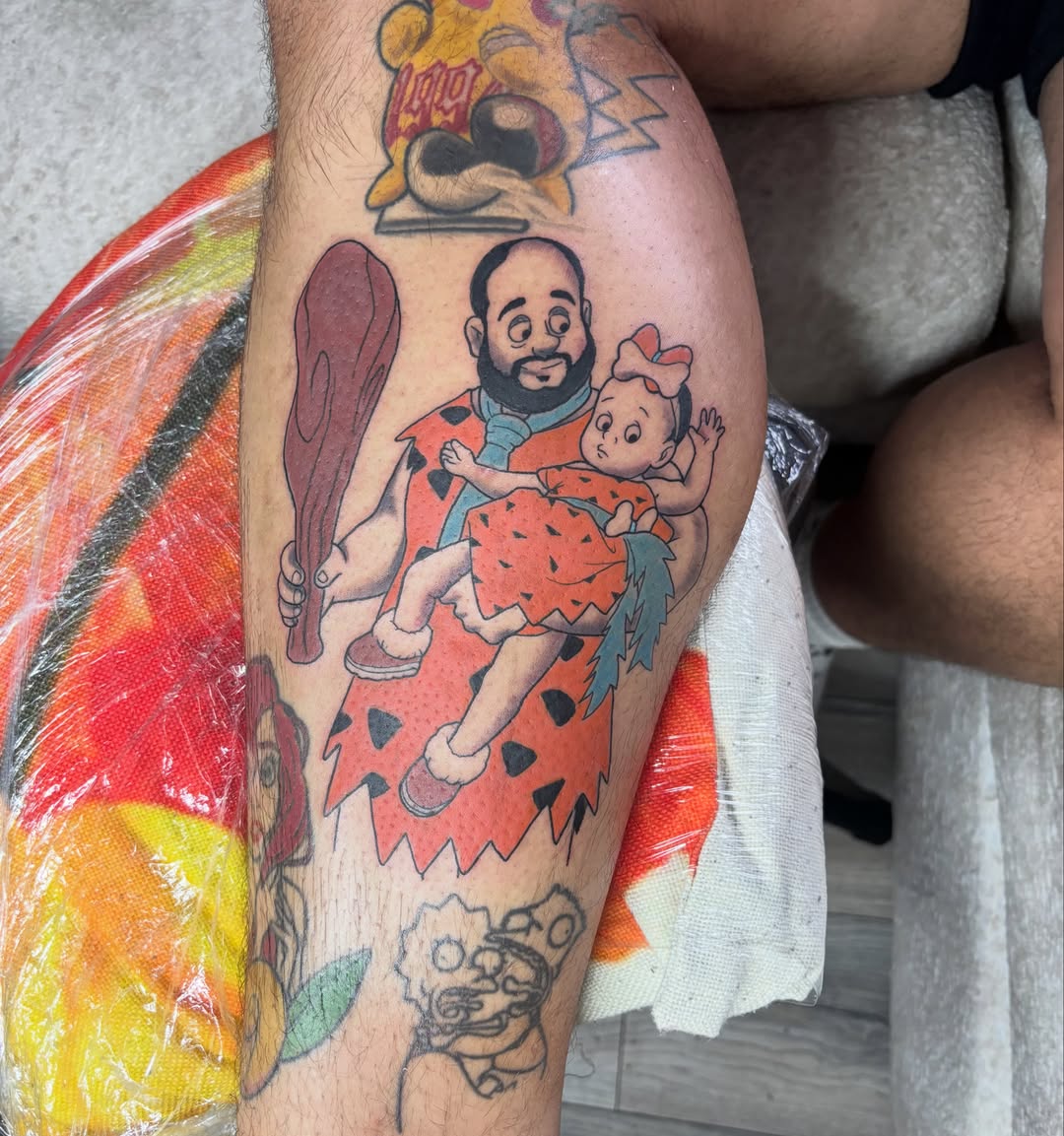 Flintstones characters illustrative tattoo on the leg by Comic-Book-M πͺβπ½π₯
