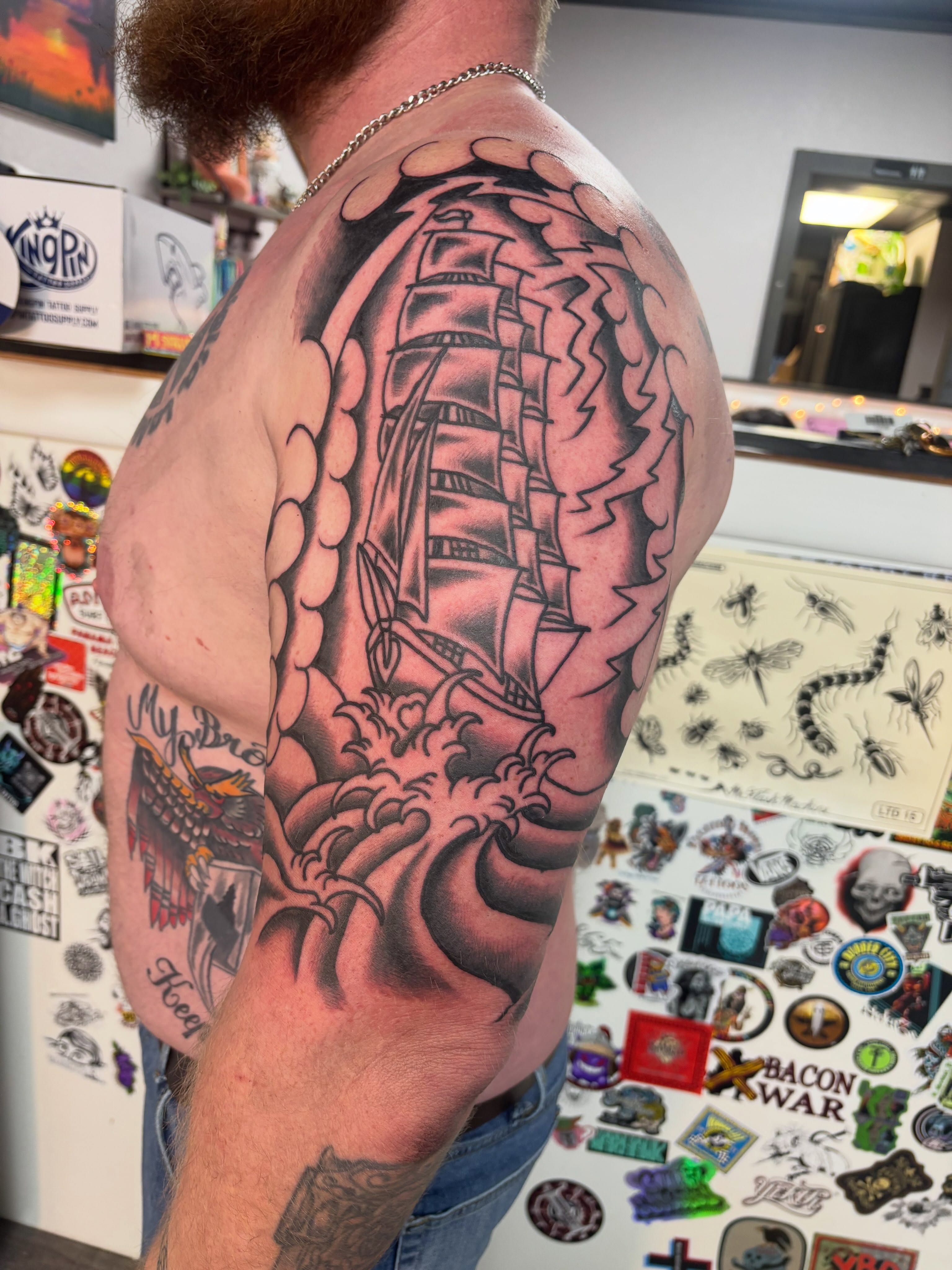 Ship sailing through waves realism tattoo on the shoulder by Bold Will Hold ๐ค