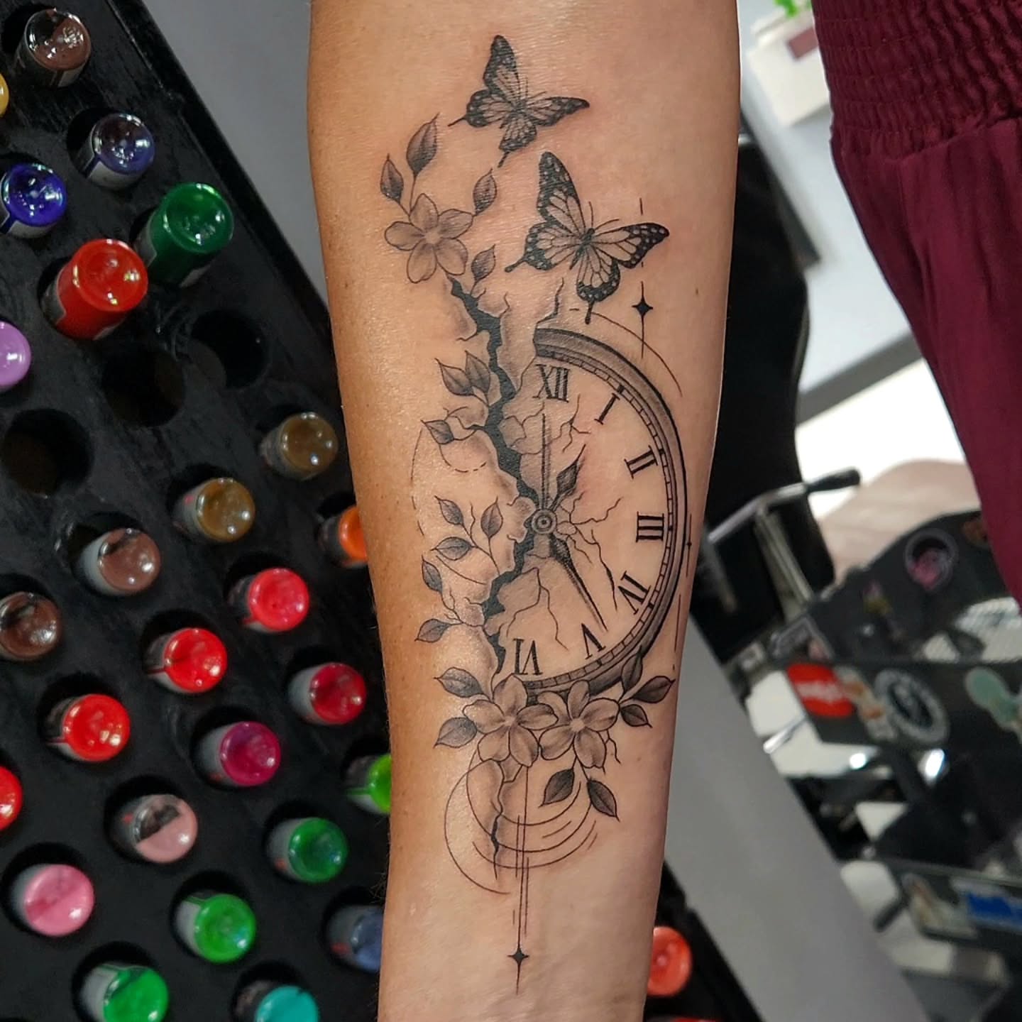 Clock and butterflies realism tattoo on the forearm by Jason August