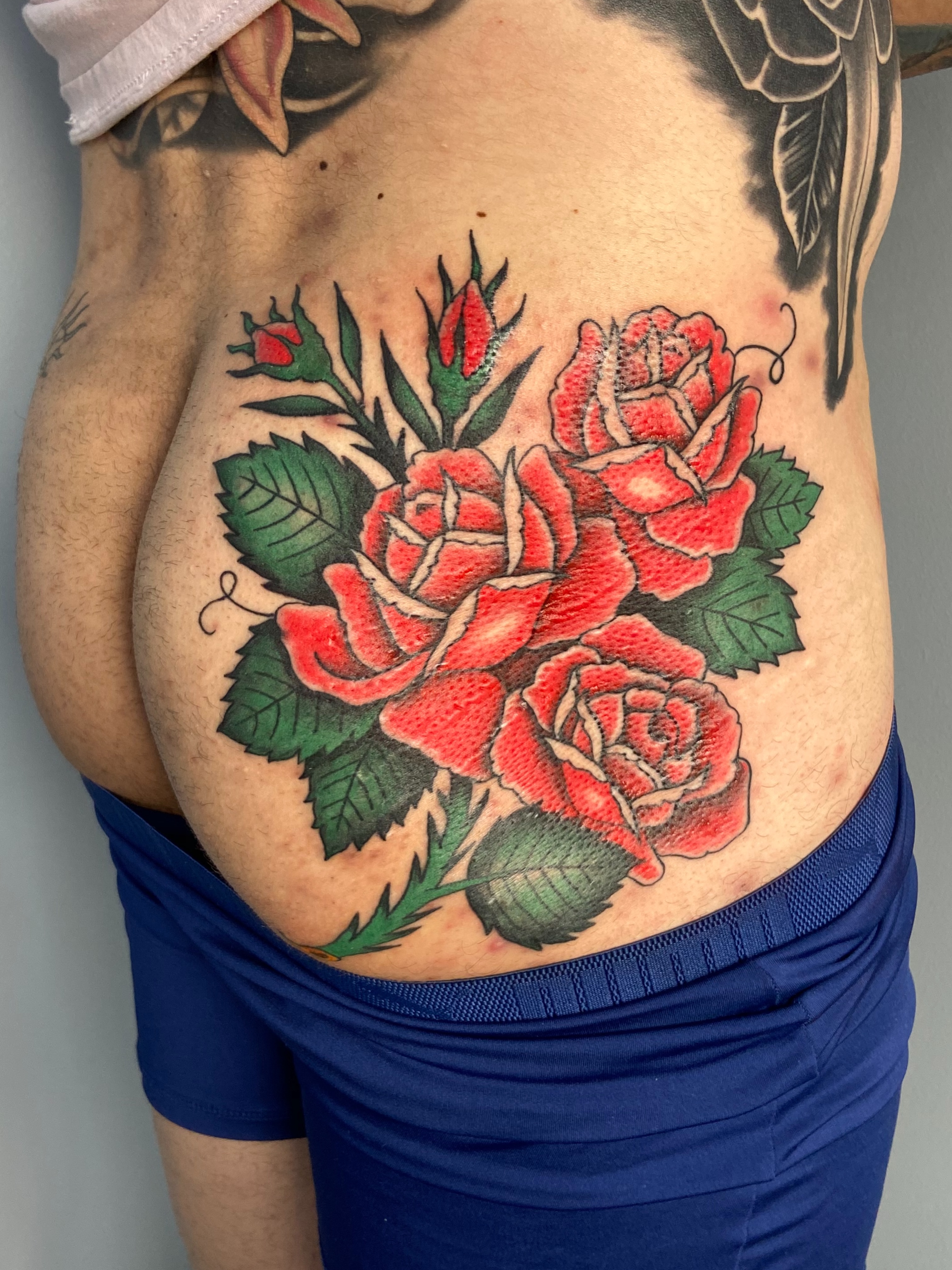 Roses American traditional tattoo on the ribs by Derek Krueger Portland Tattoo Artist, Portland, Oregon